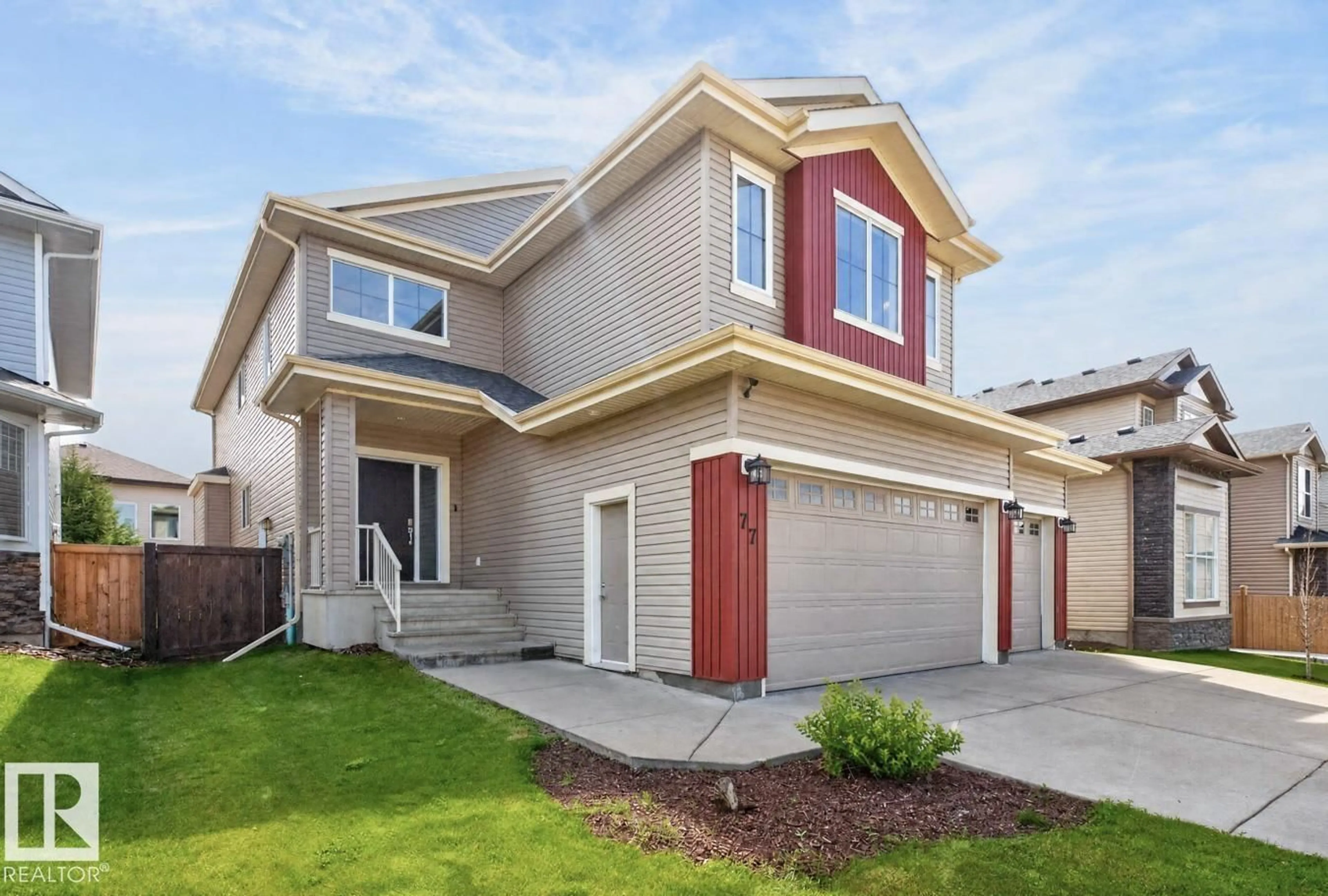 Home with vinyl exterior material, street for 77 CARAGANA WY, Fort Saskatchewan Alberta T8L0H4