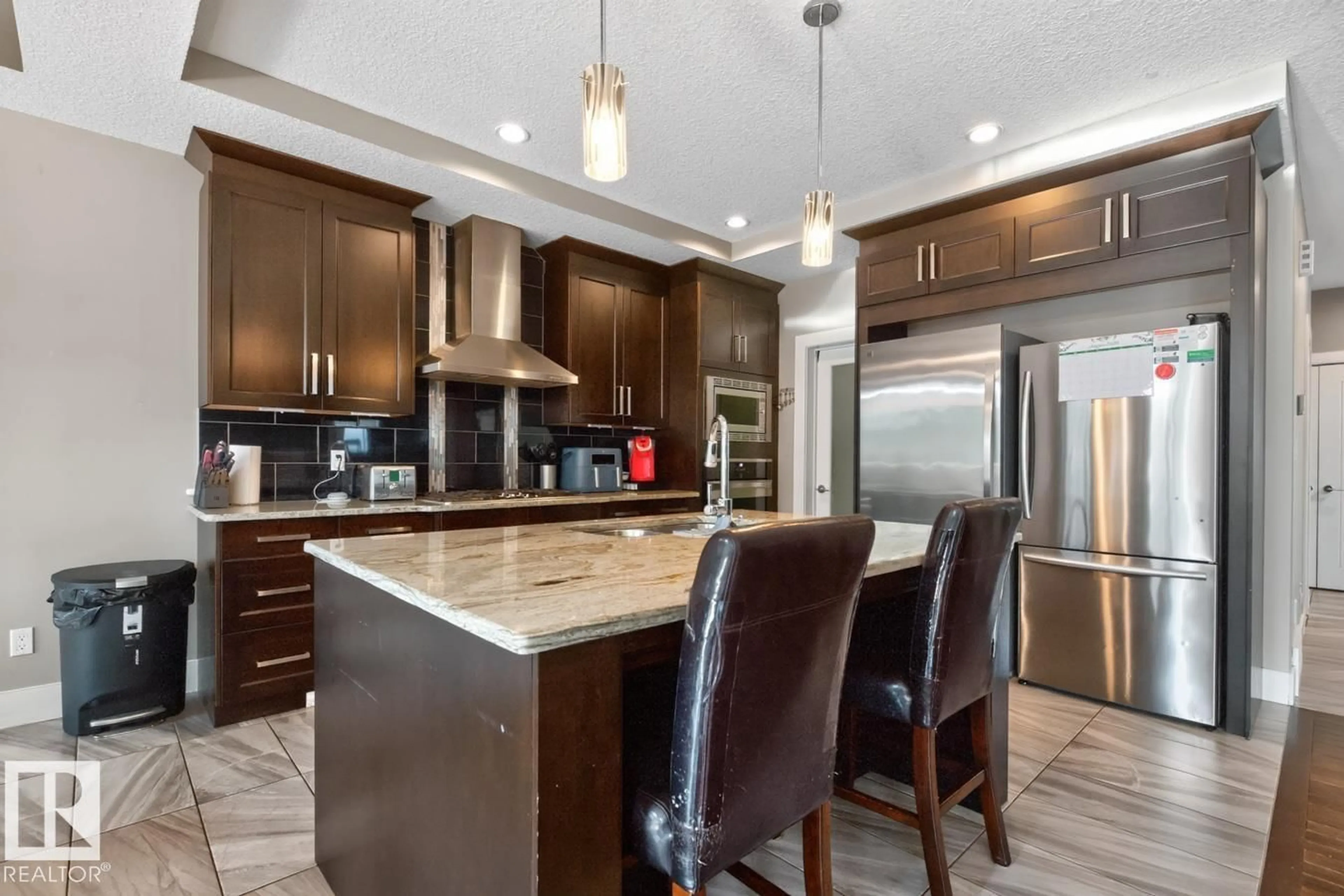 Open concept kitchen, ceramic/tile floor for 77 CARAGANA WY, Fort Saskatchewan Alberta T8L0H4