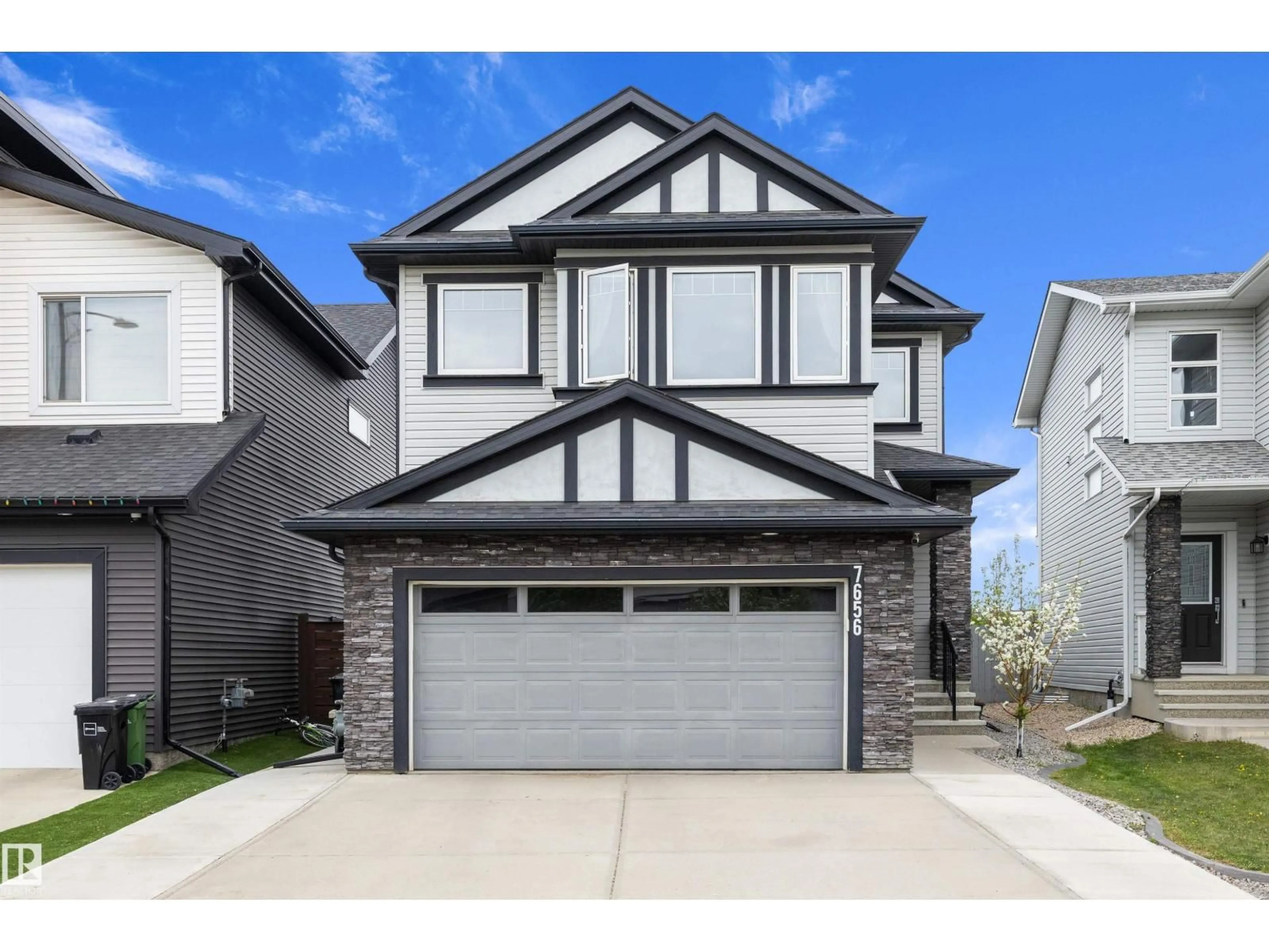 Home with vinyl exterior material, street for 7656 182 AV, Edmonton Alberta T5Z0L8
