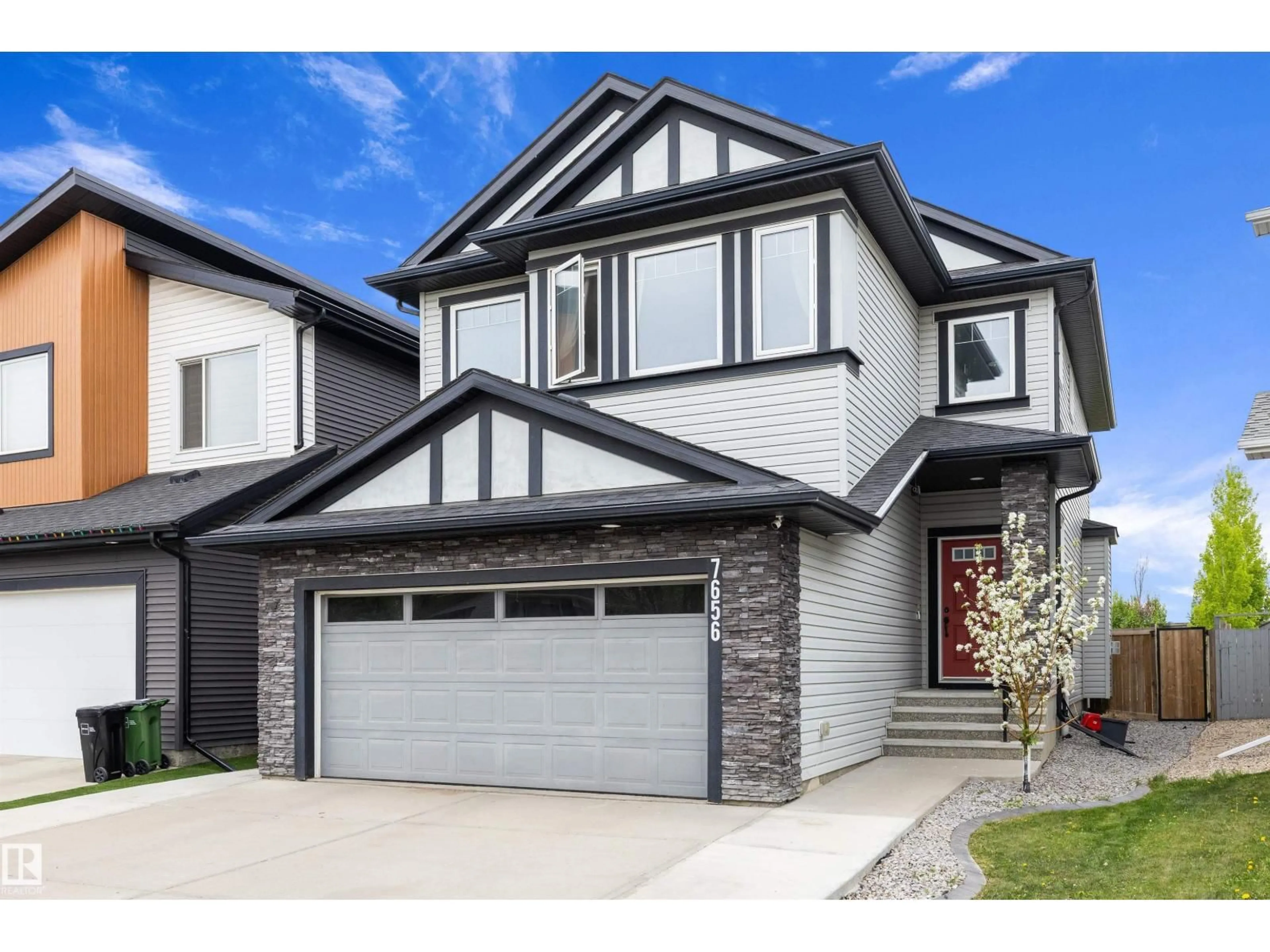 Home with vinyl exterior material, street for 7656 182 AV, Edmonton Alberta T5Z0L8
