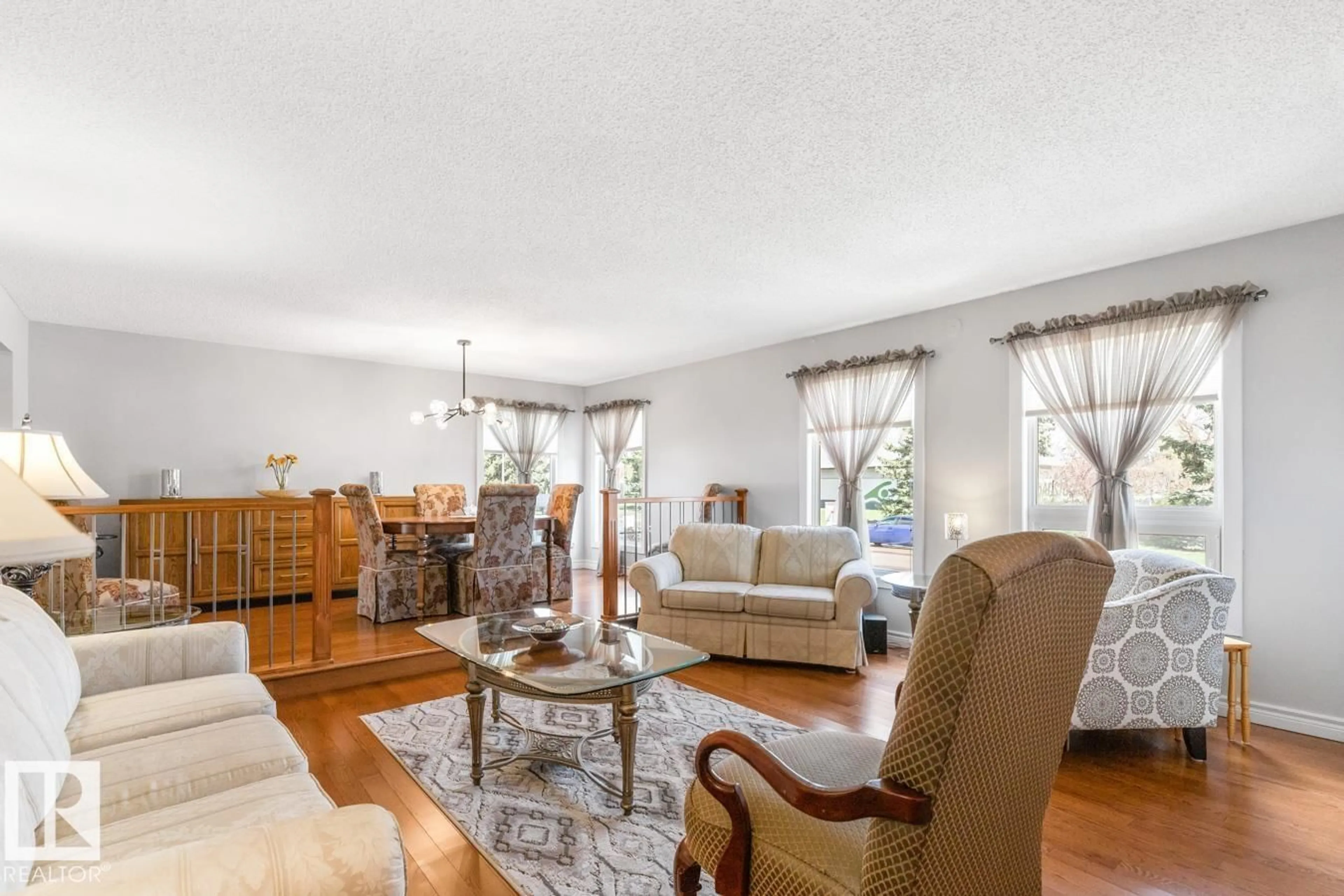 Living room with furniture, wood/laminate floor for NW - 10502 158 ST, Edmonton Alberta T5P2Y6
