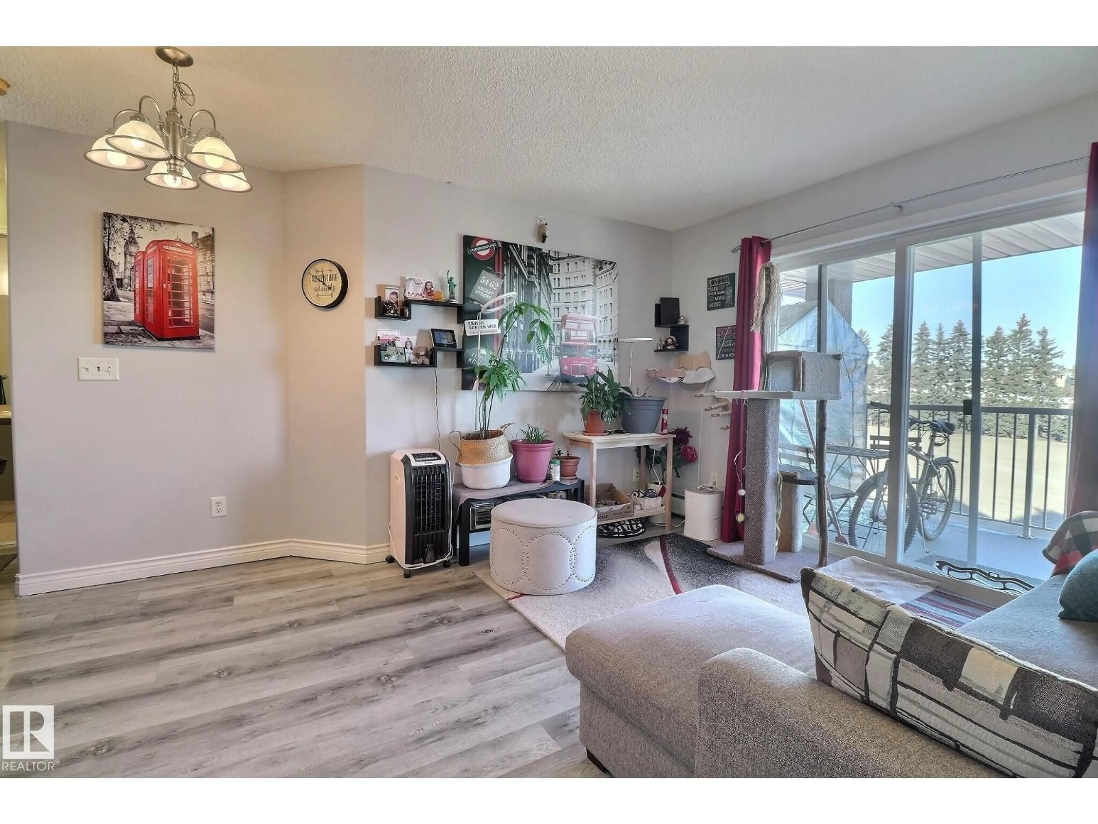 Living room with furniture, wood/laminate floor for #416 - 14708 50 ST, Edmonton Alberta T5A5G9