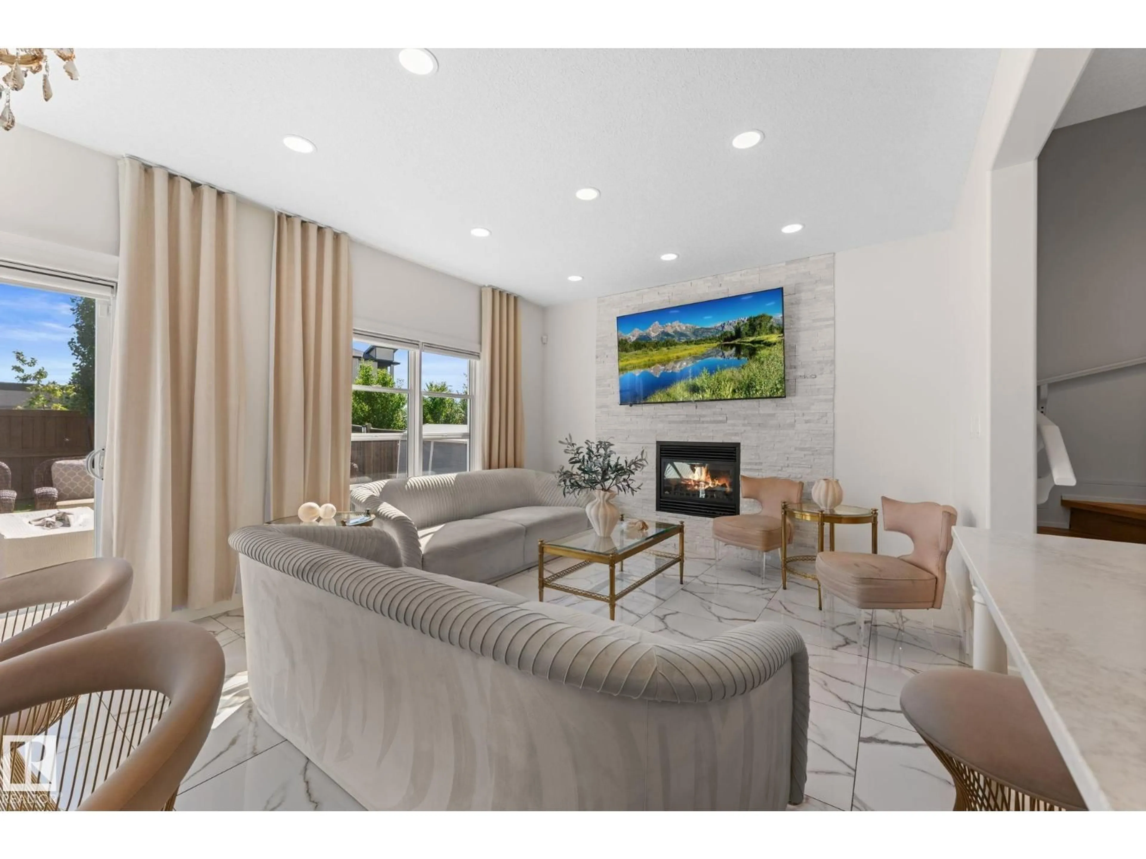 Living room with furniture, ceramic/tile floor for 5415 167A AV, Edmonton Alberta T5Y0R4