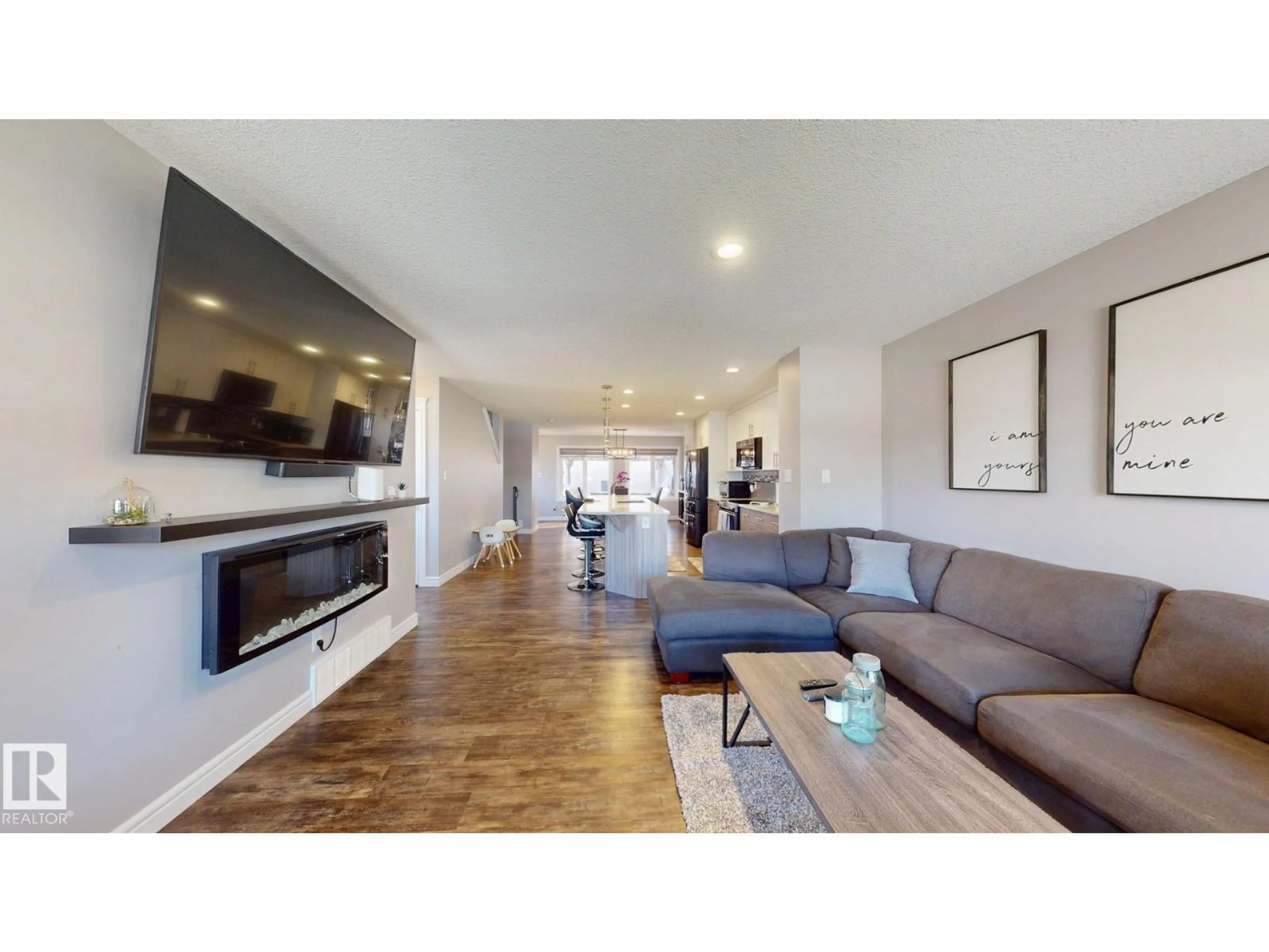Living room with furniture, wood/laminate floor for NW - 17359 49 ST, Edmonton Alberta T5Y3W1