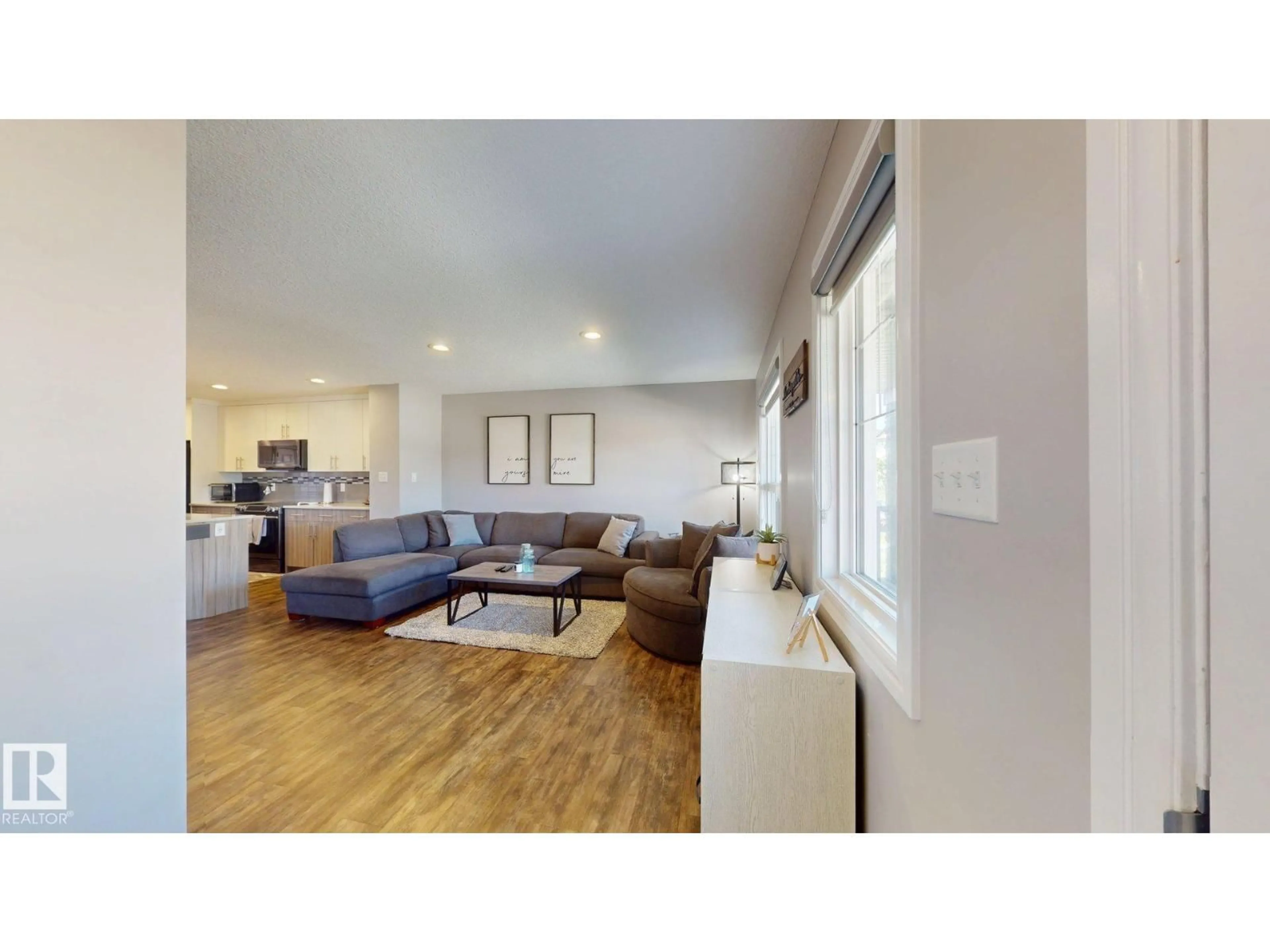 Living room with furniture, wood/laminate floor for NW - 17359 49 ST, Edmonton Alberta T5Y3W1
