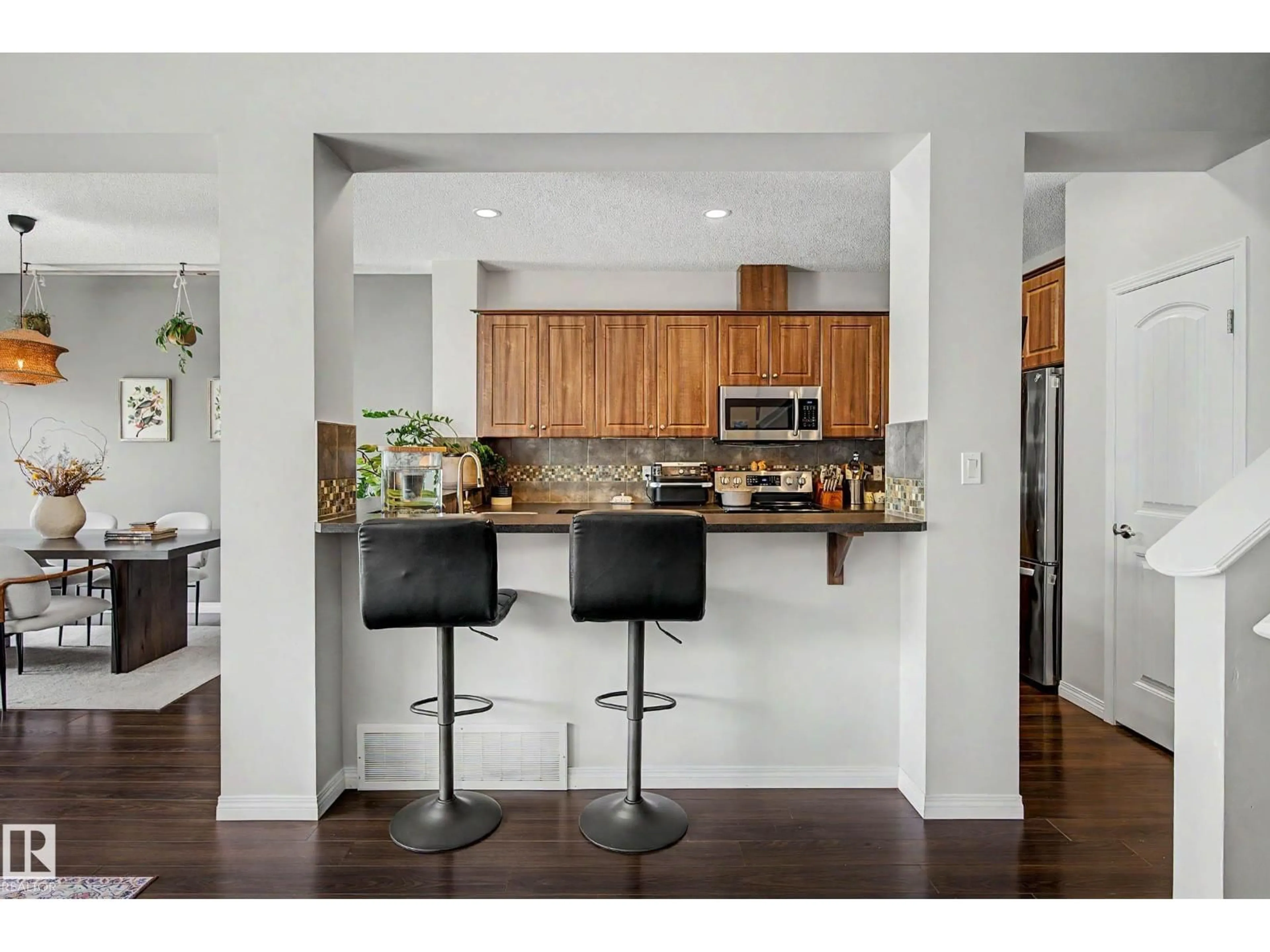 Open concept kitchen, wood/laminate floor for NW - 6107 176 AV, Edmonton Alberta T5Y3N8