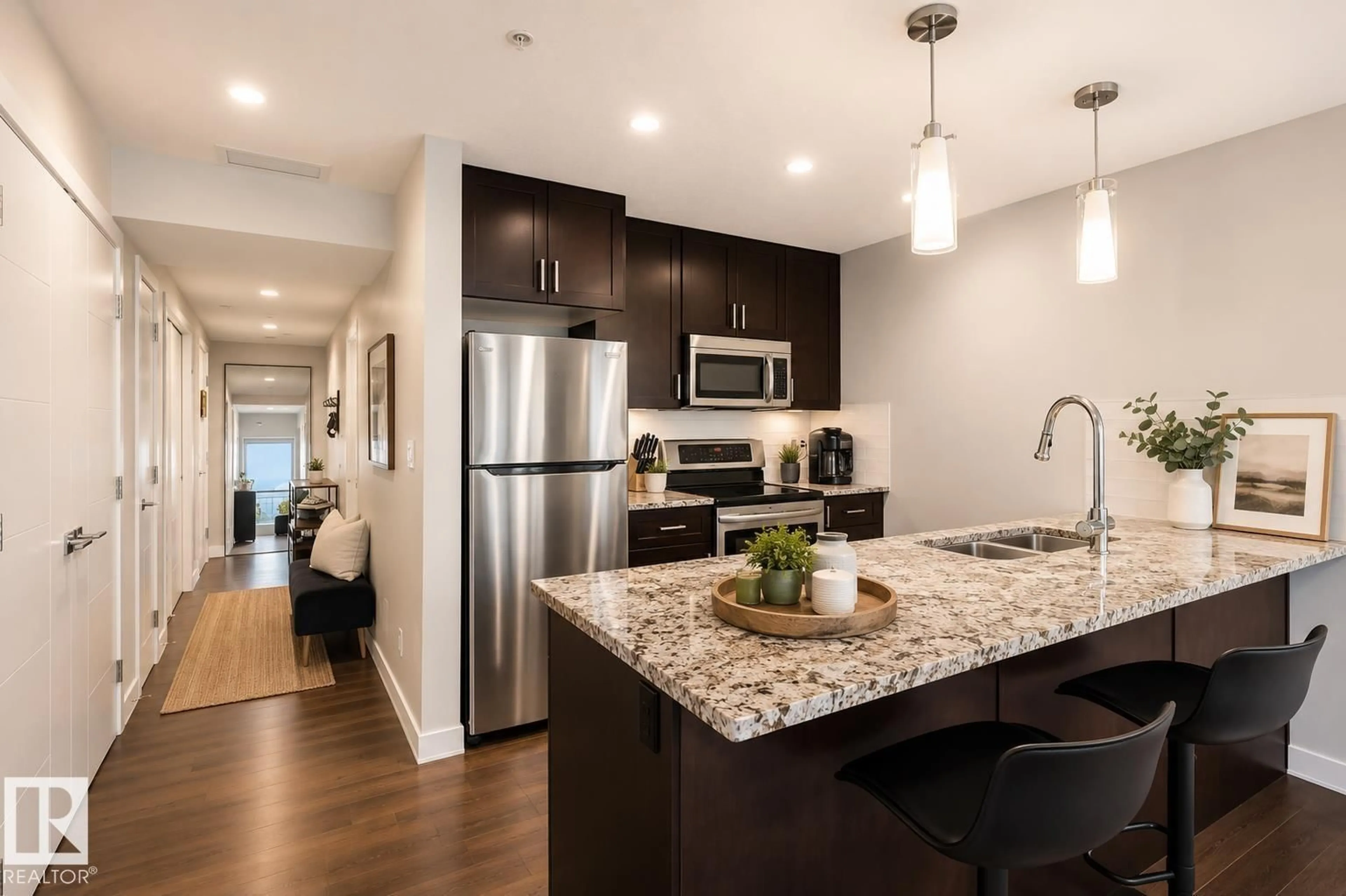 Open concept kitchen, wood/laminate floor for #908 - 10238 103 ST, Edmonton Alberta T5J0G6