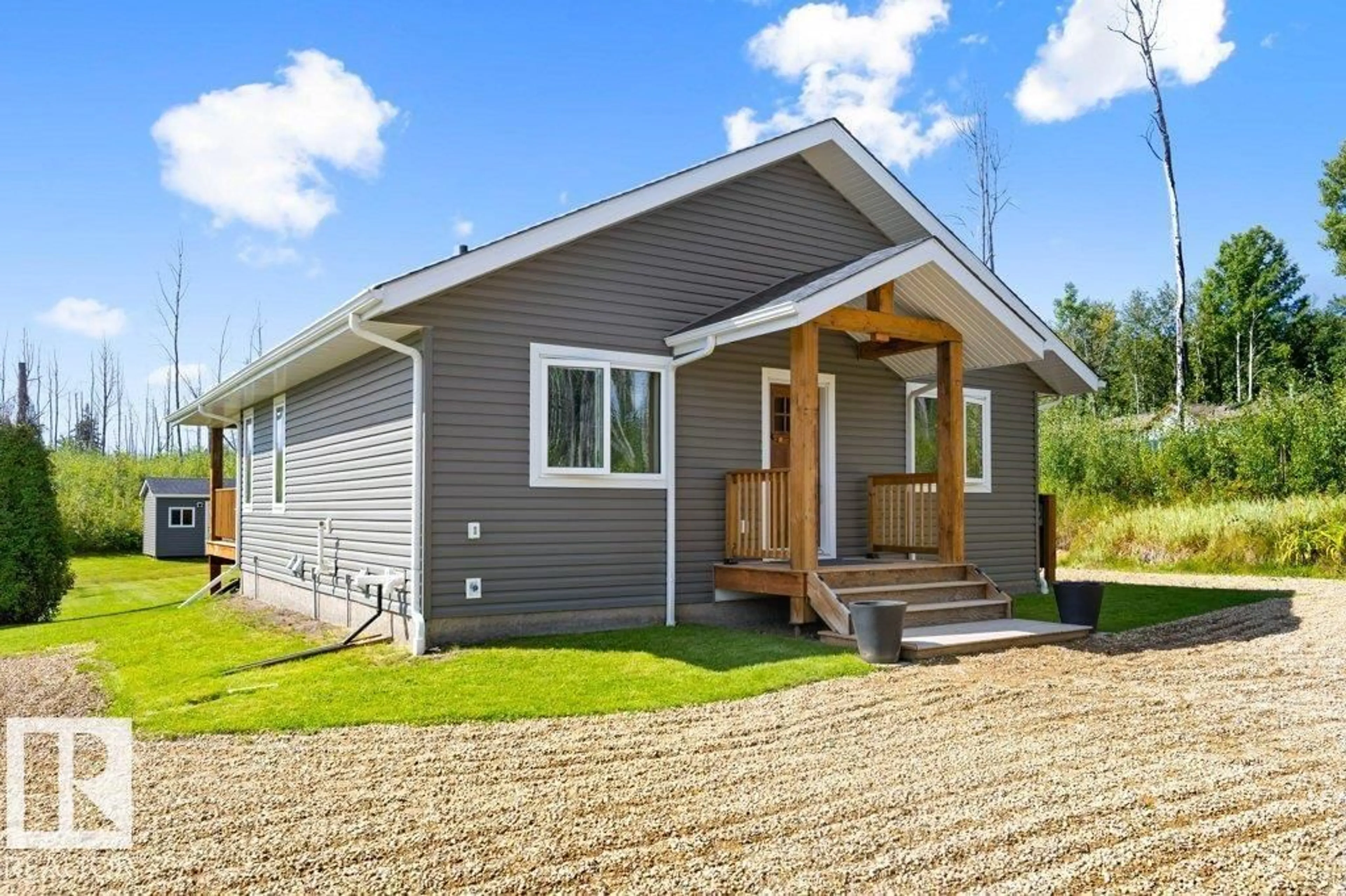 Home with vinyl exterior material, street for #106 - 5124 TWP ROAD 554, Rural Lac Ste. Anne County Alberta T0E0L0