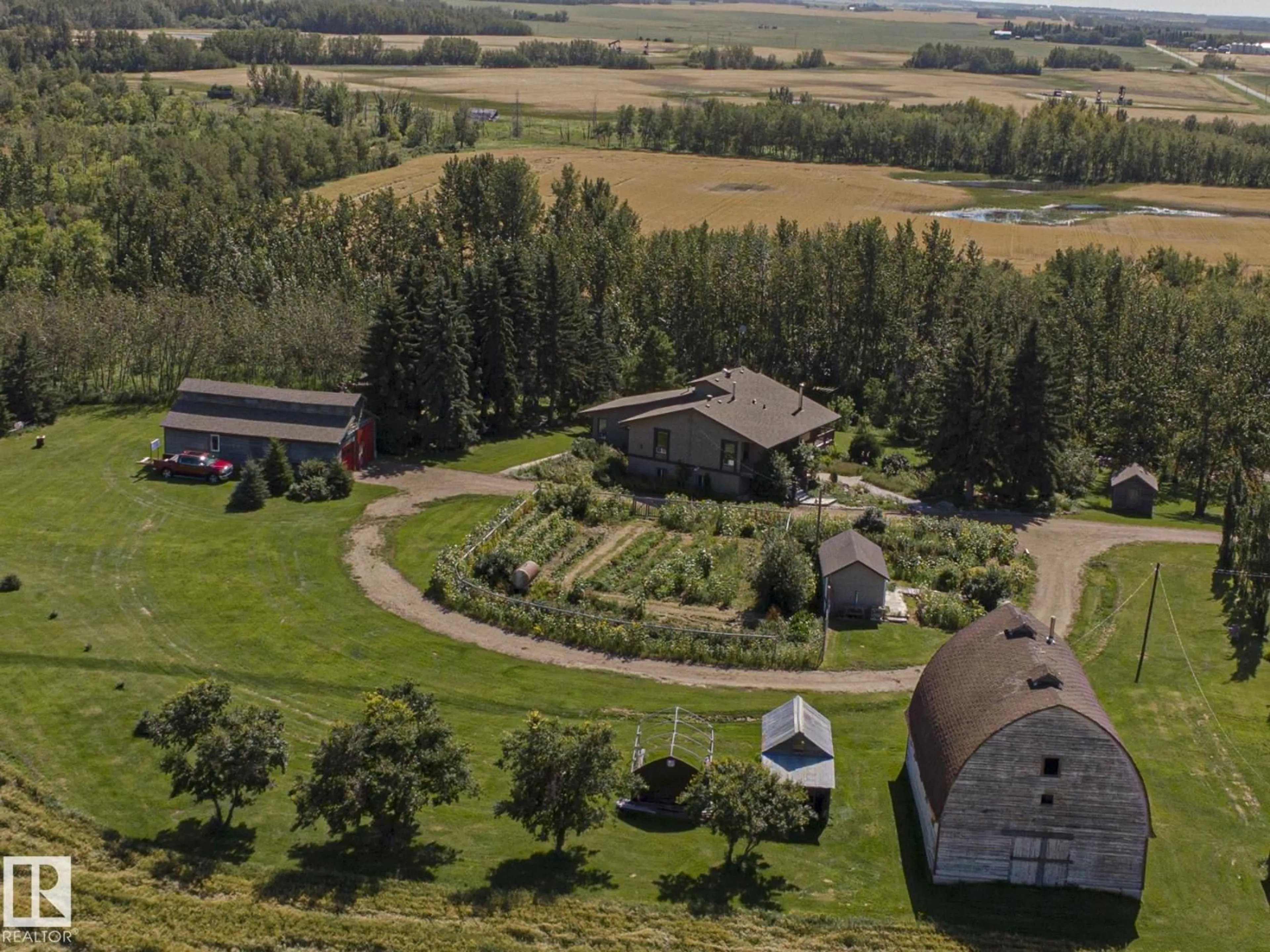 A pic from outside/outdoor area/front of a property/back of a property/a pic from drone, mountain view for 55257 RGE RD 212, Rural Strathcona County Alberta T8L4A9