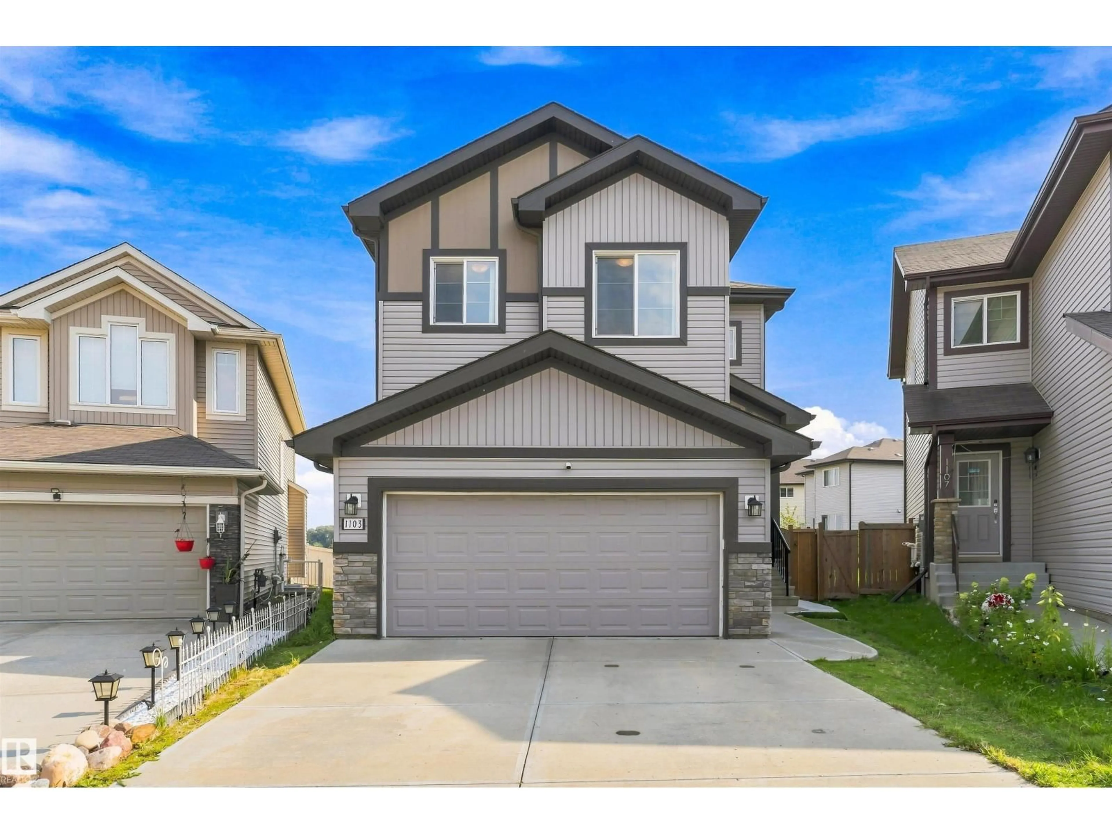 Home with vinyl exterior material, street for 1103 26 AV, Edmonton Alberta T6T0V9