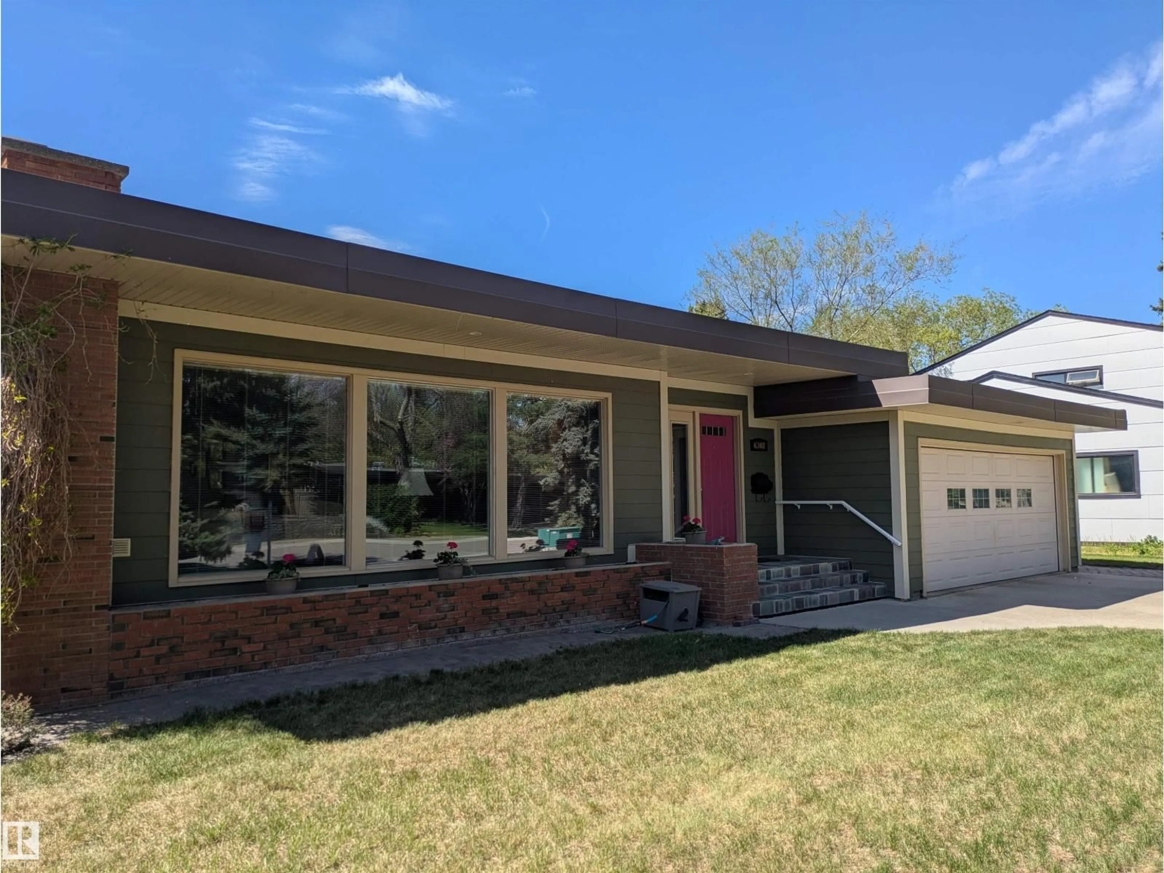 Home with vinyl exterior material, street for 6308 131 ST NW, Edmonton Alberta T6H3Y3
