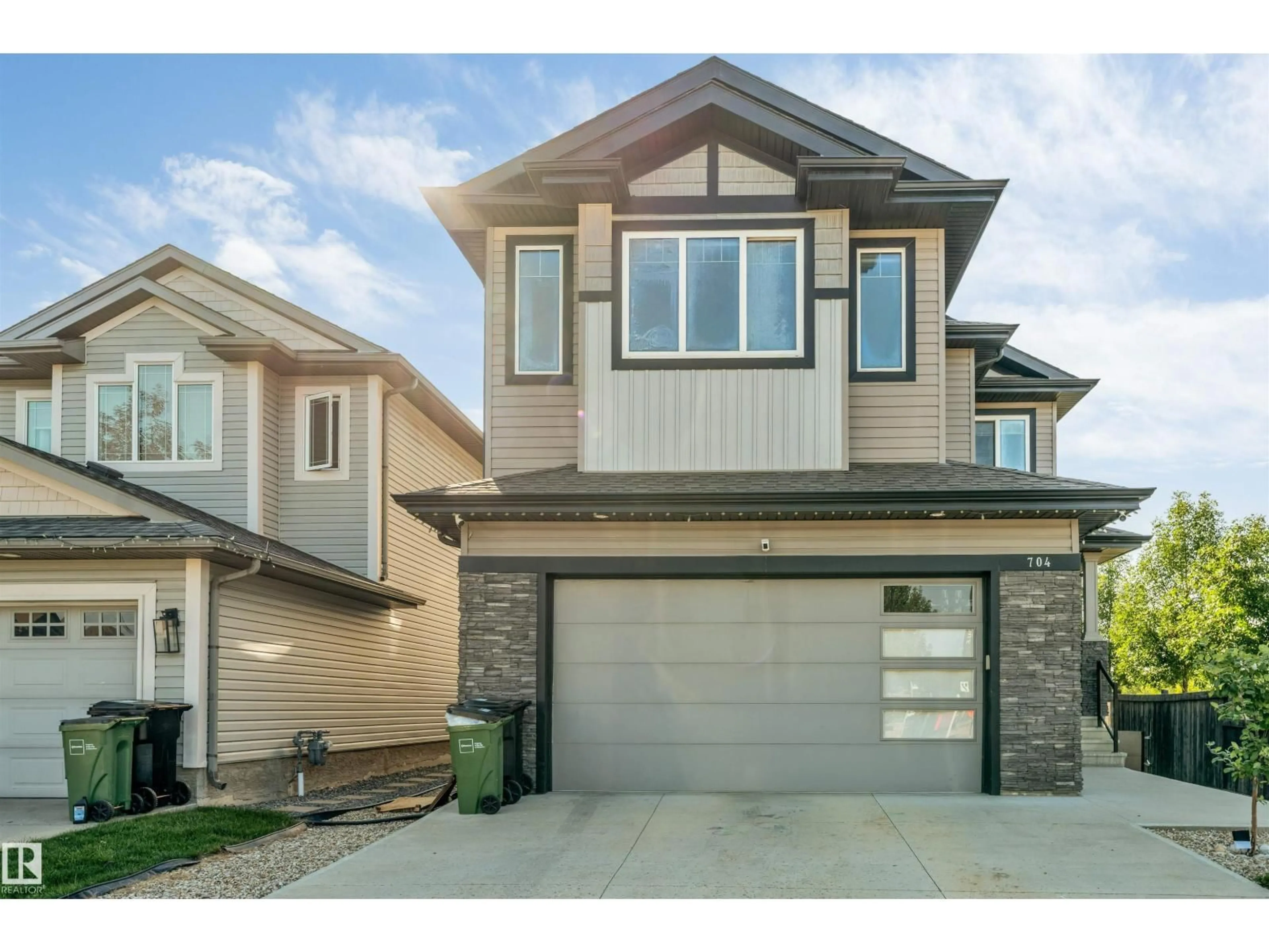 Home with vinyl exterior material, street for SW - 704 172 ST, Edmonton Alberta T6W0M5