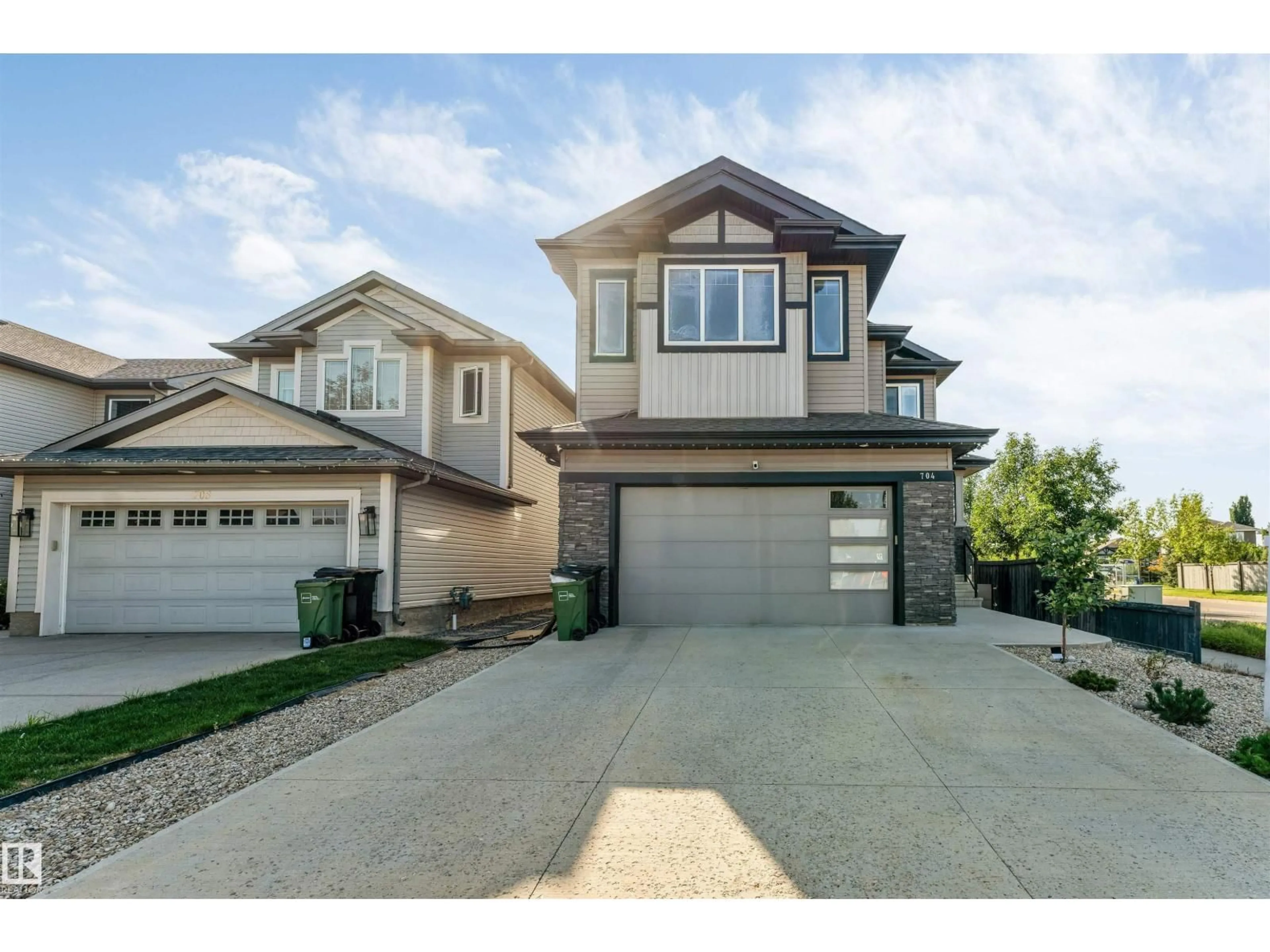 Home with vinyl exterior material, street for SW - 704 172 ST, Edmonton Alberta T6W0M5
