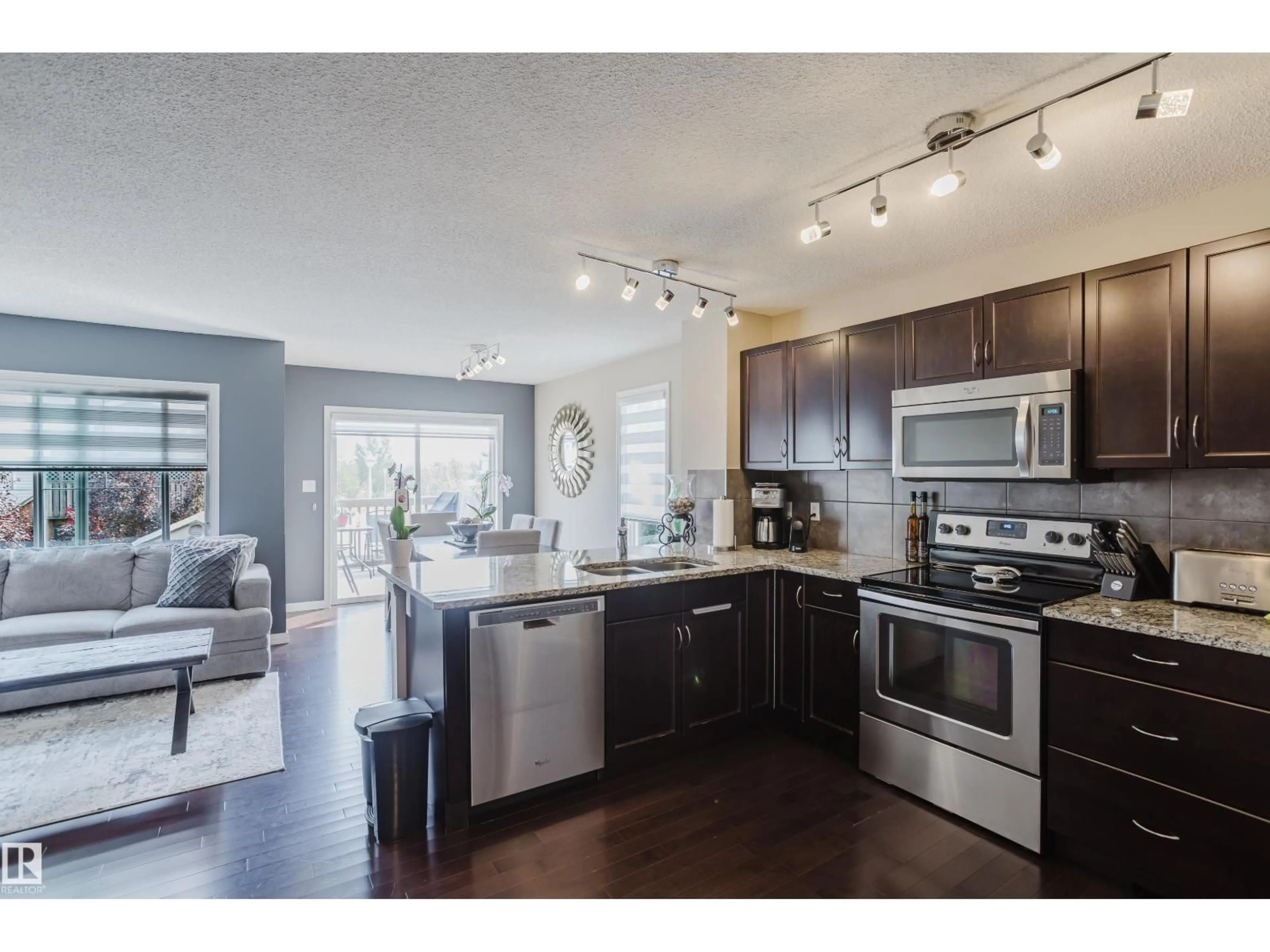 Open concept kitchen, wood/laminate floor for NW - 16345 134 ST, Edmonton Alberta T6V0G4