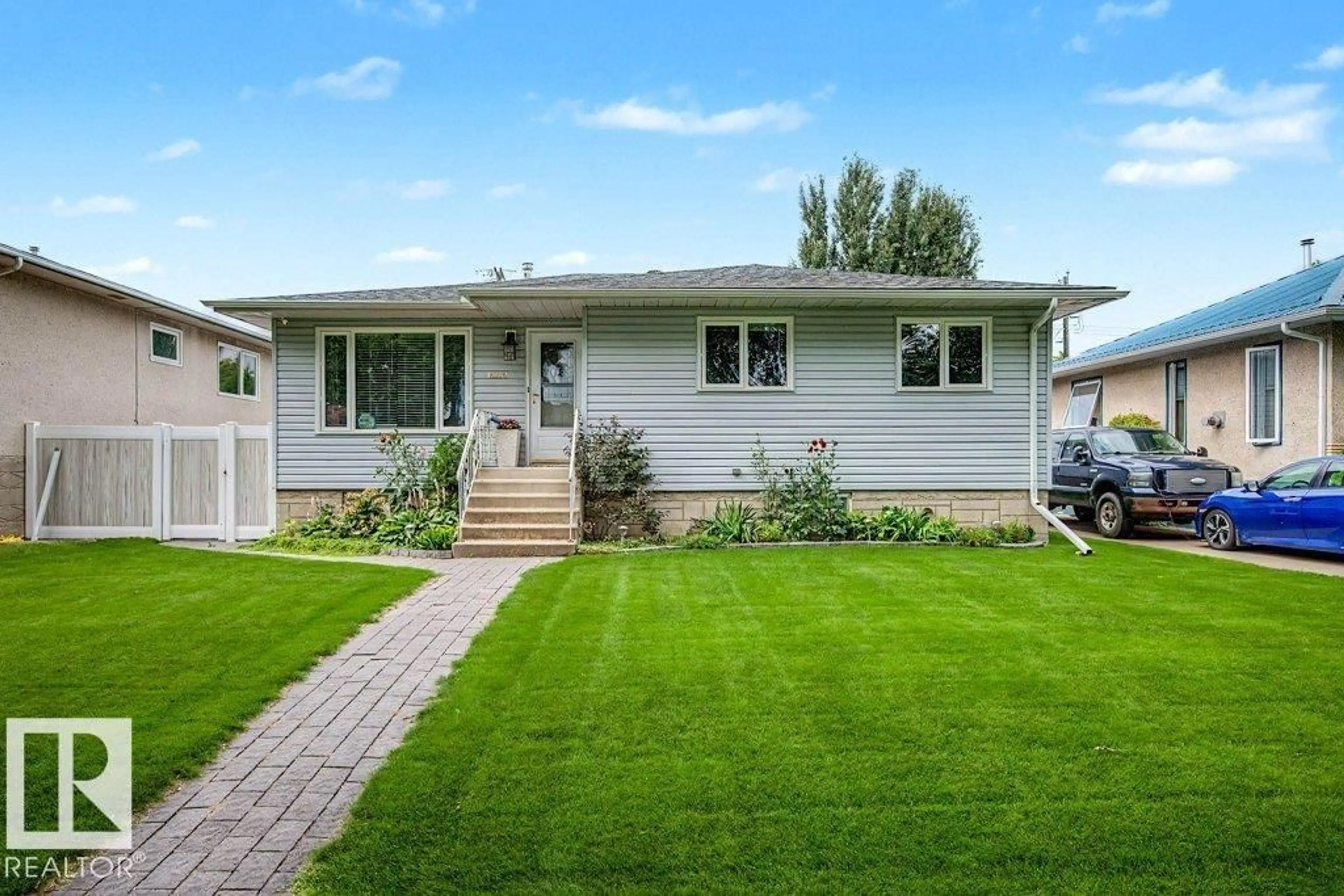 Home with vinyl exterior material, street for 12112 38 ST, Edmonton Alberta T5W2J1