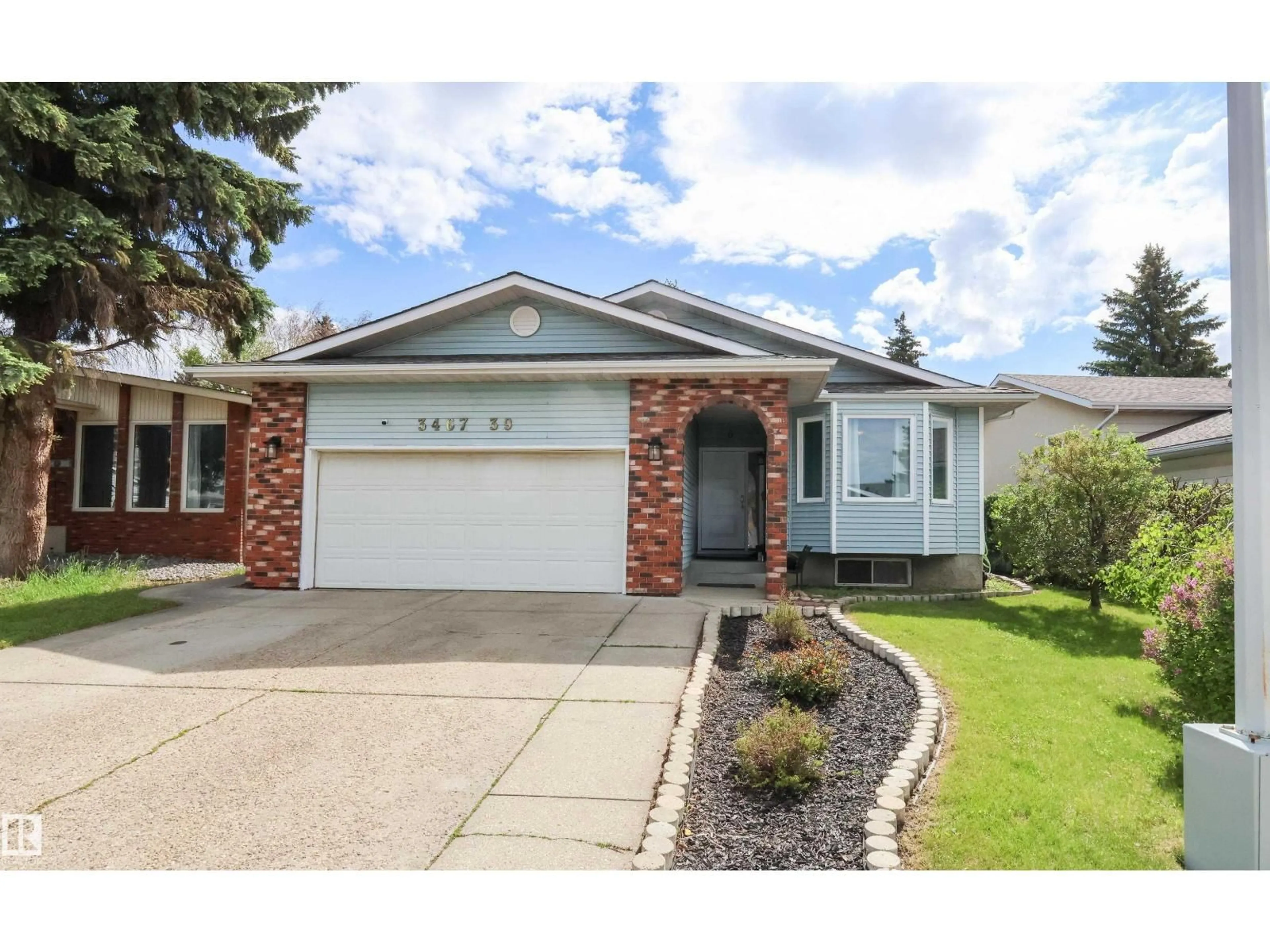 Home with vinyl exterior material, street for NW - 3467 39 ST, Edmonton Alberta T6L3Y9