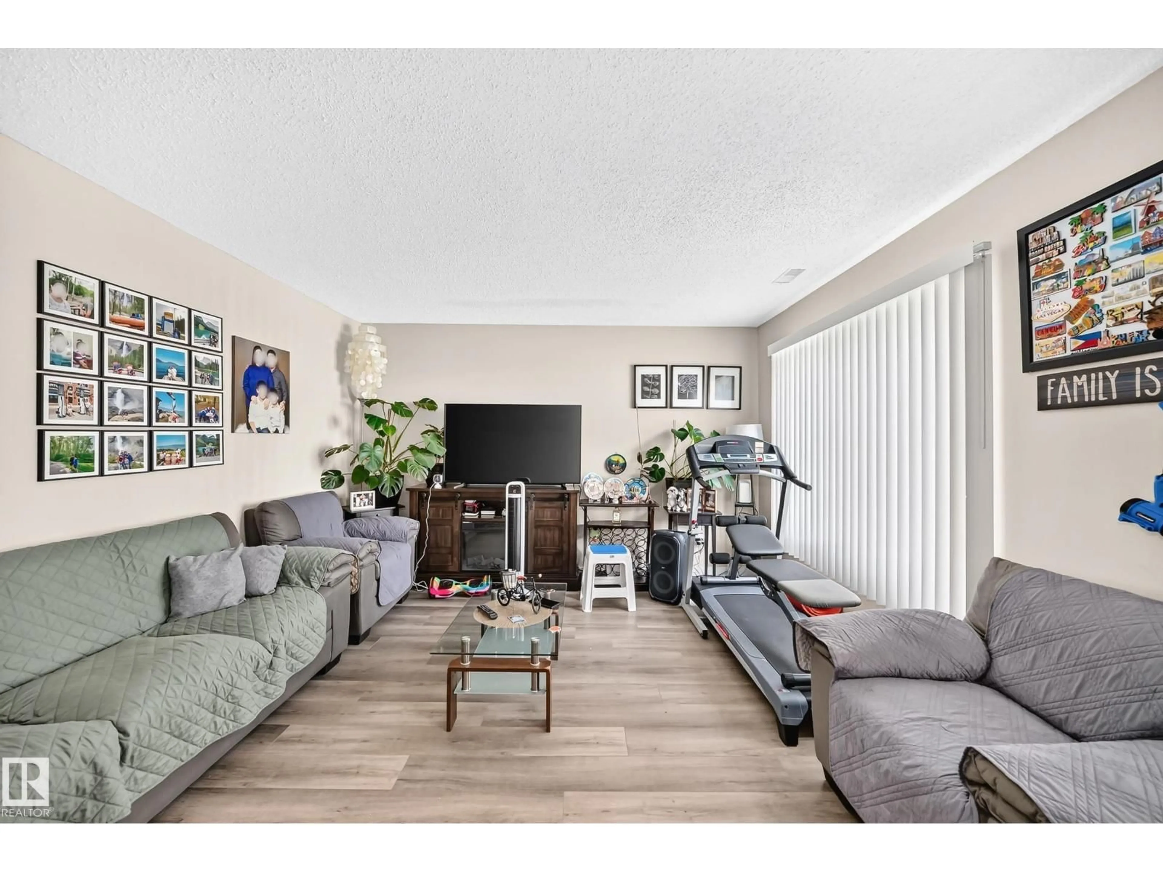 Living room with furniture, wood/laminate floor for 180 - 171 BRIDGEPORT BV, Leduc Alberta T9E8S1