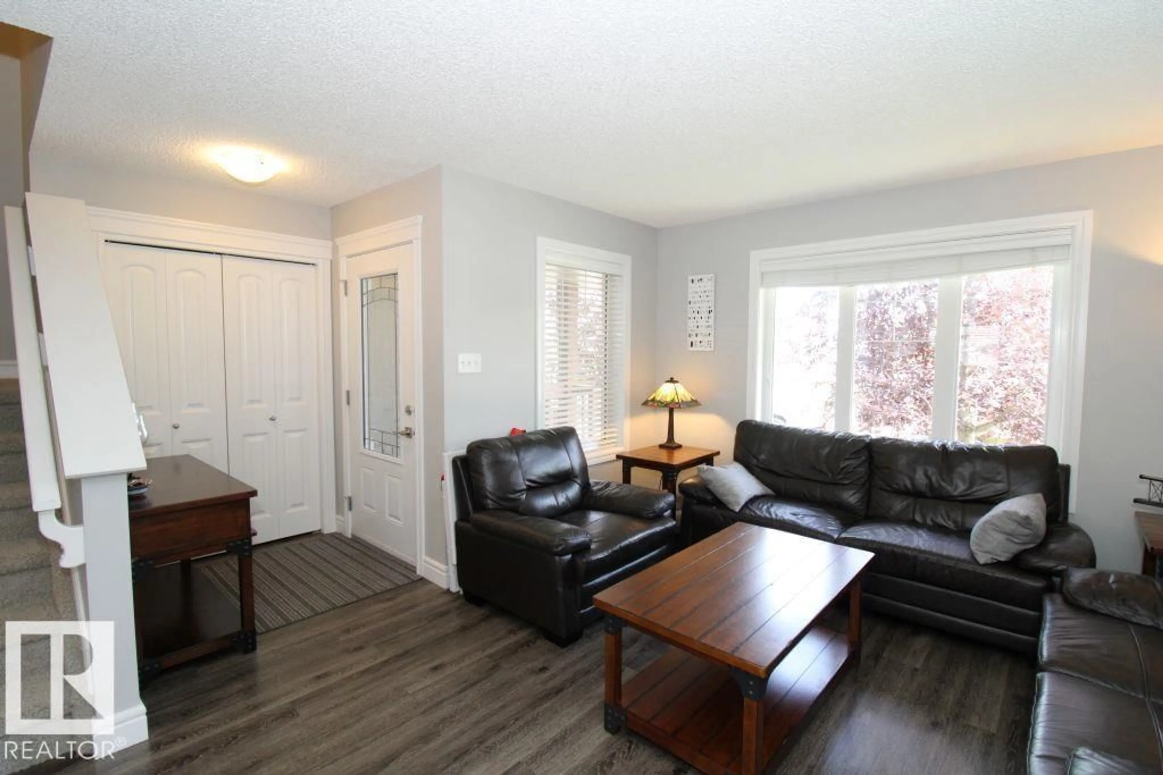 Living room with furniture, wood/laminate floor for 31 HARVEST RIDGE DR, Spruce Grove Alberta T7S0S1