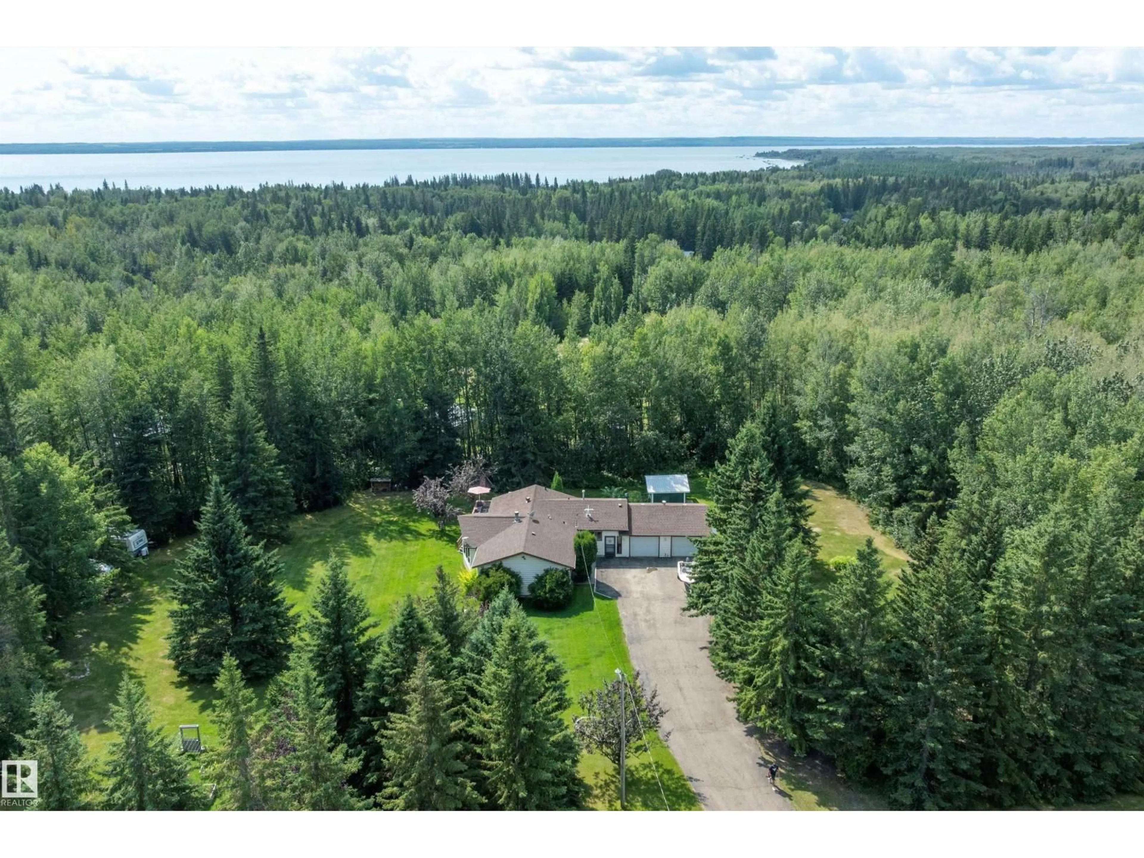 A pic from outside/outdoor area/front of a property/back of a property/a pic from drone, water/lake/river/ocean view for 801 HIGHLAND RD, Rural Wetaskiwin County Alberta T0C2C0