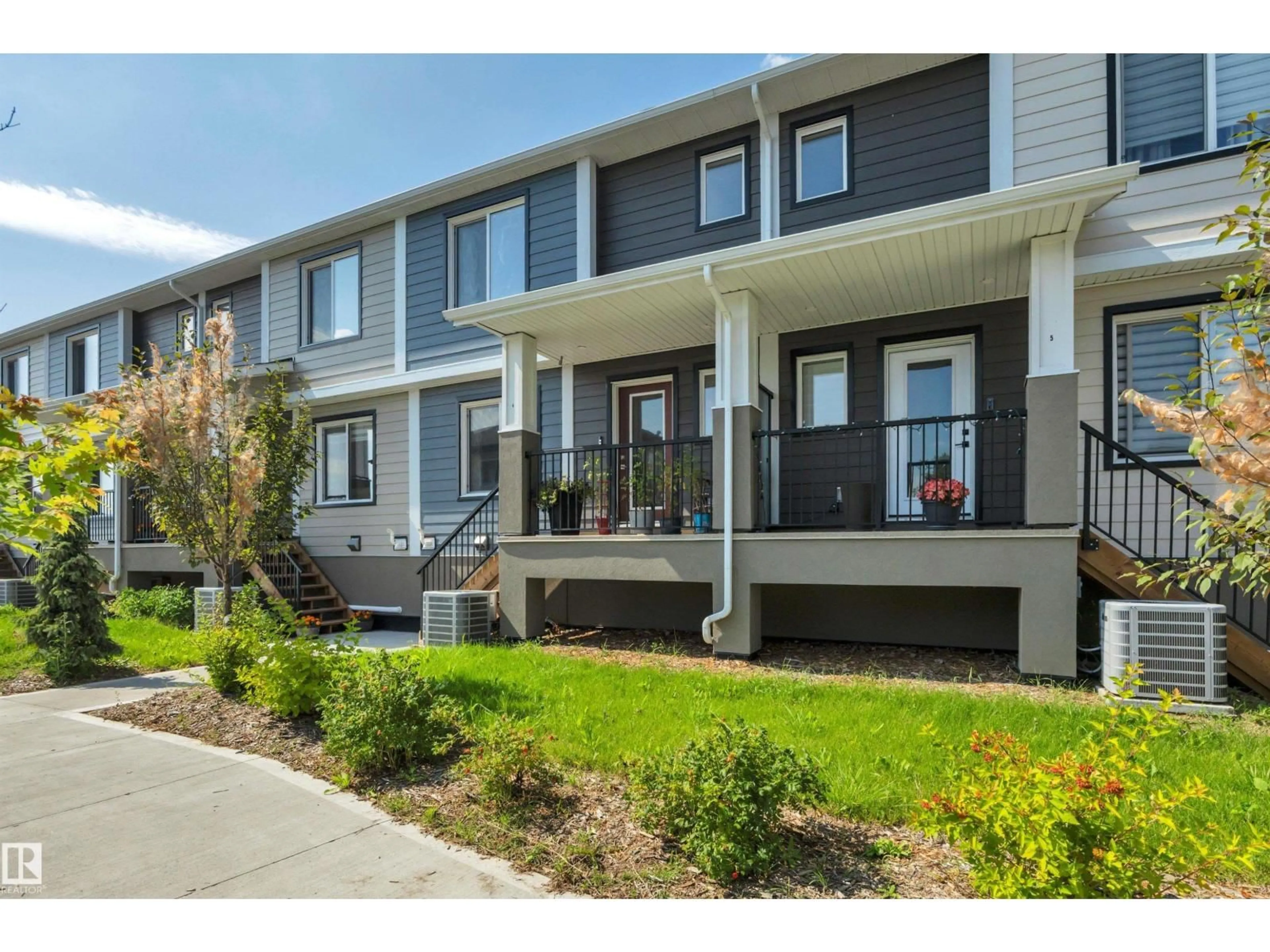 Home with vinyl exterior material, street for #4 - 9250 156 AV NW, Edmonton Alberta T5Z0S4