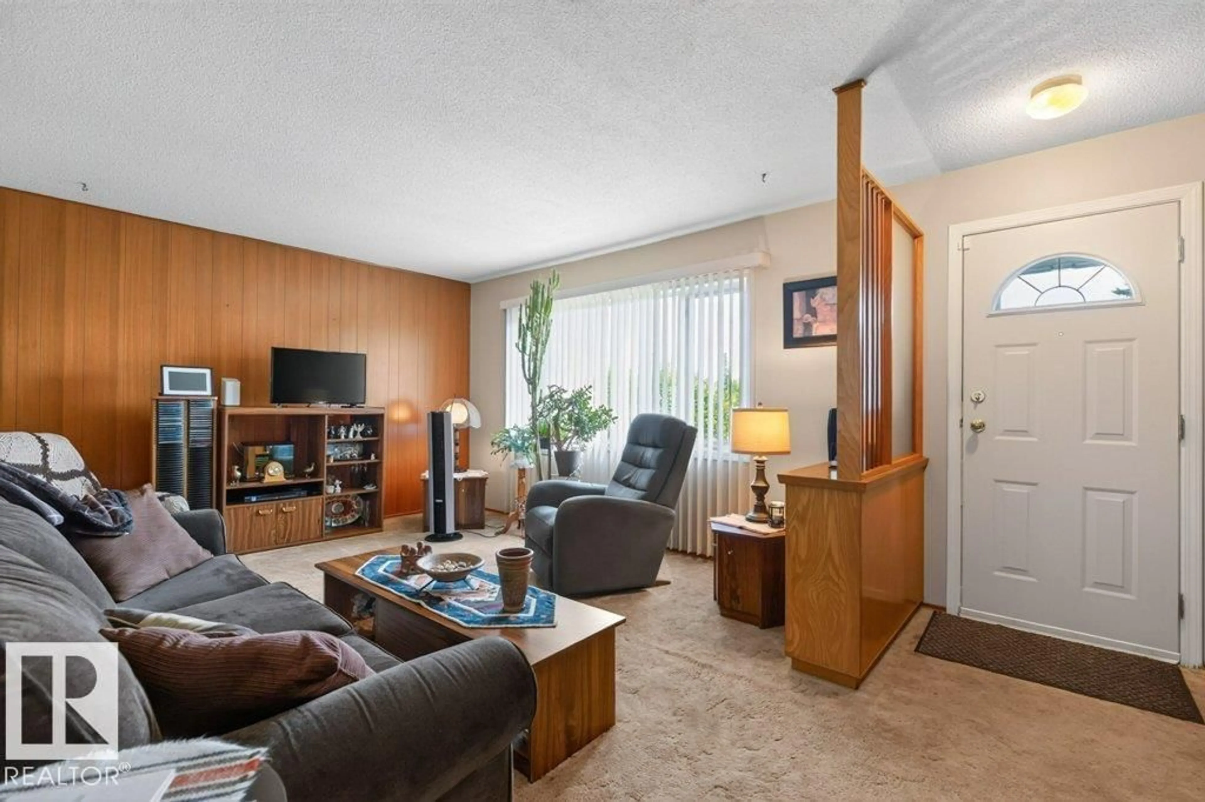 Living room with furniture, wood/laminate floor for 13526 91 ST, Edmonton Alberta T5E3R1
