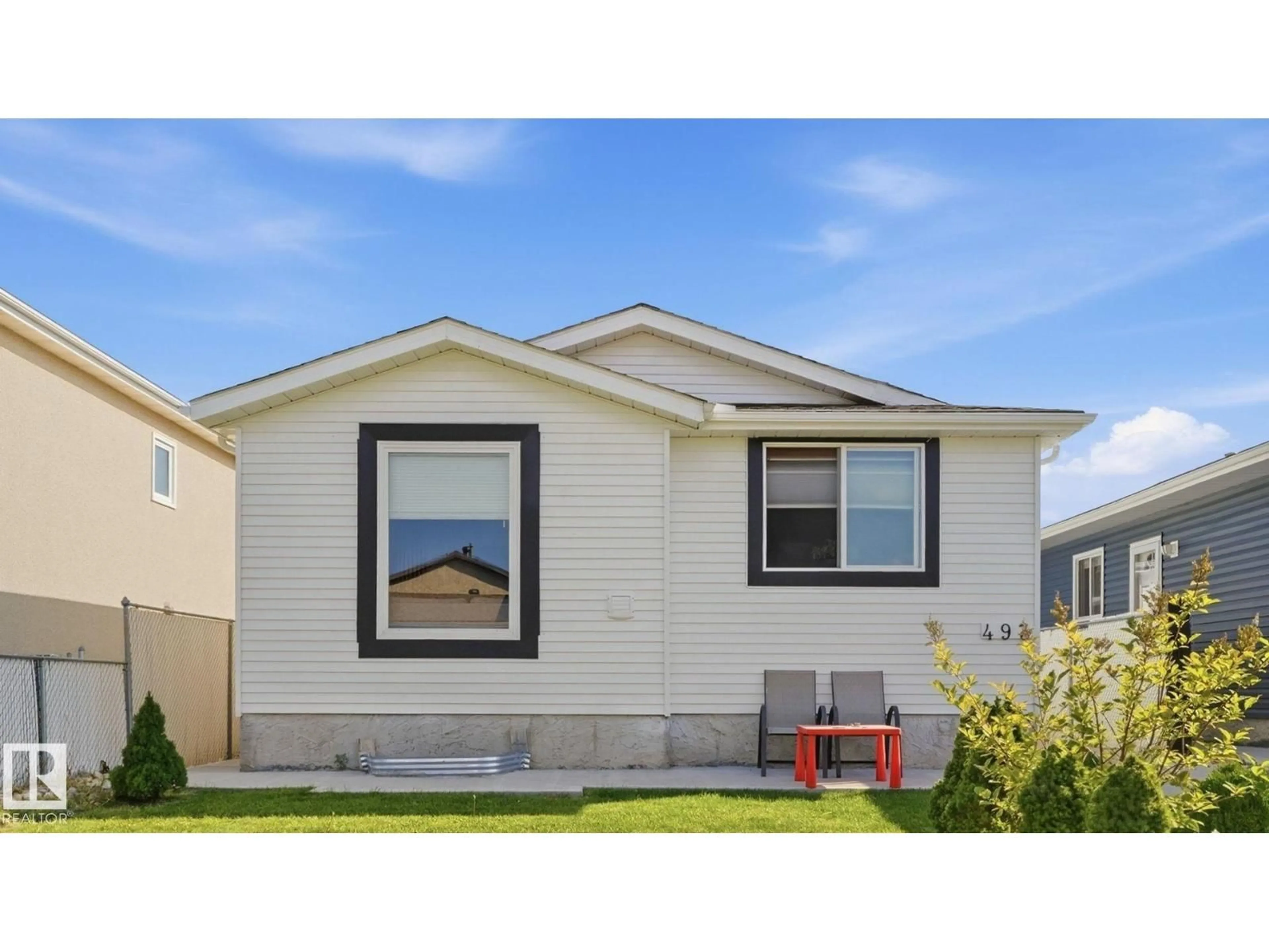 Home with vinyl exterior material, street for 493 KIRKNESS RD, Edmonton Alberta T5Y2J1