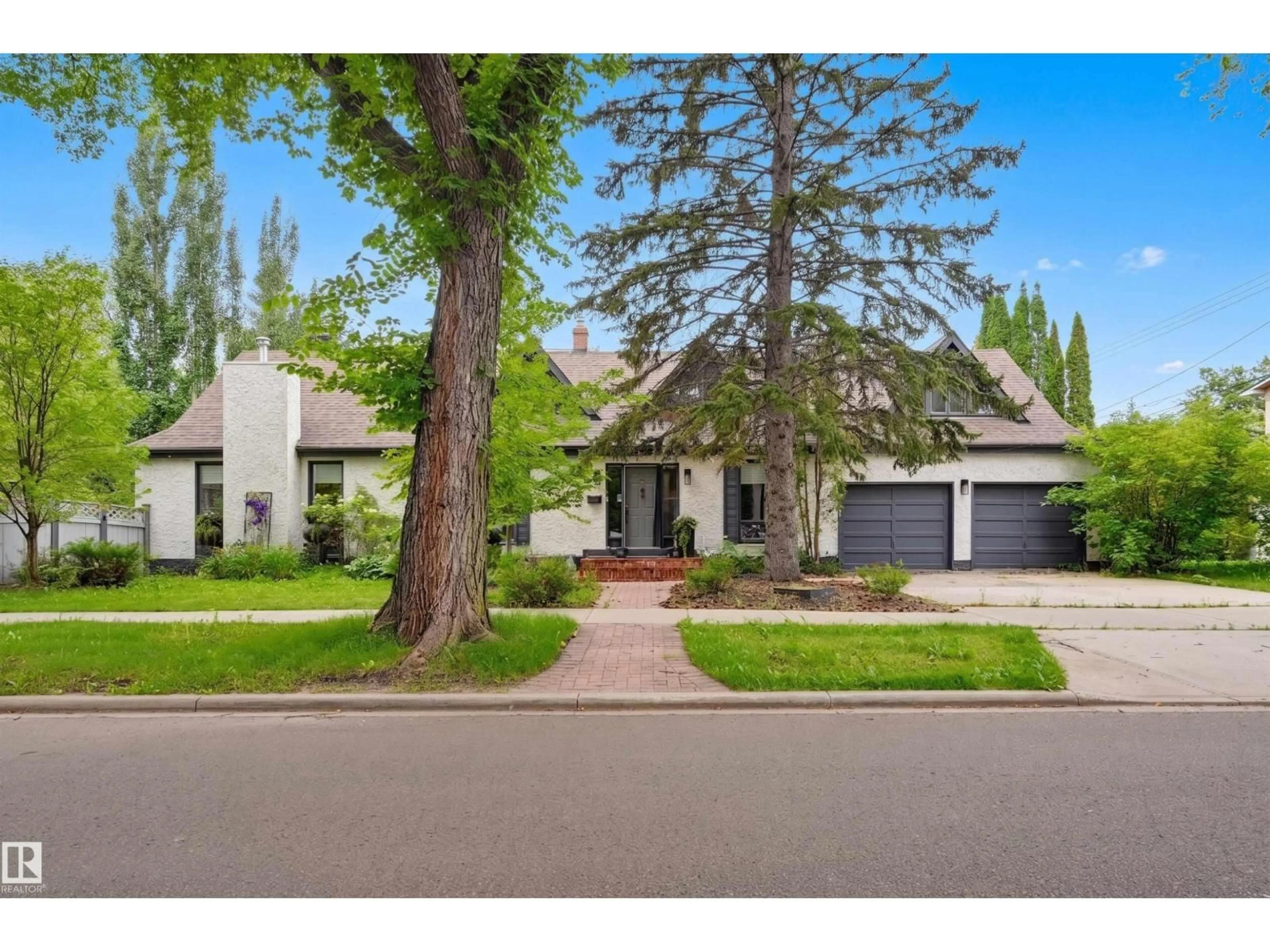 Home with brick exterior material, street for NW - 10308 134 ST, Edmonton Alberta T5N2A8