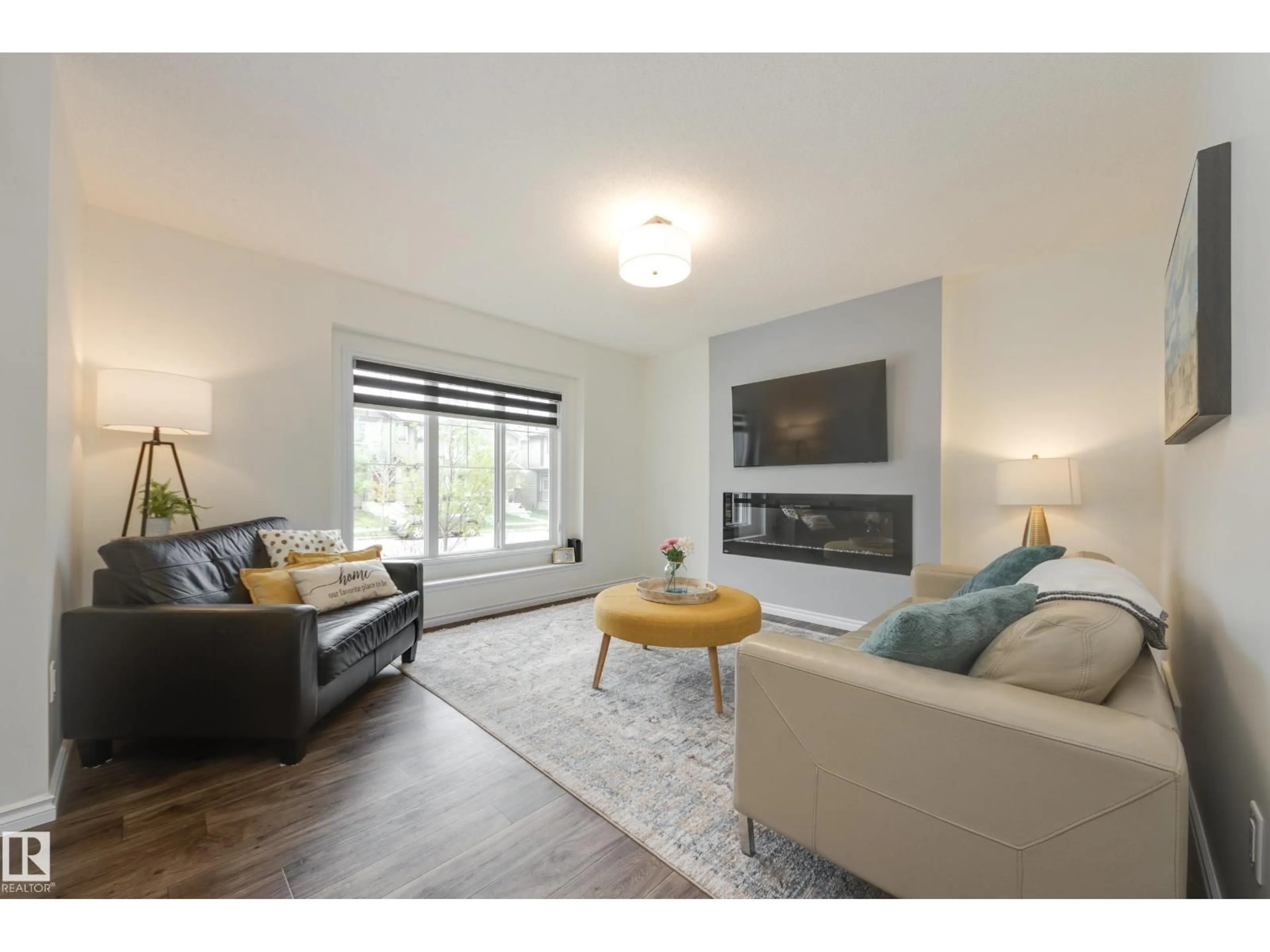 Living room with furniture, wood/laminate floor for 22123 88 AV, Edmonton Alberta T5T7H3