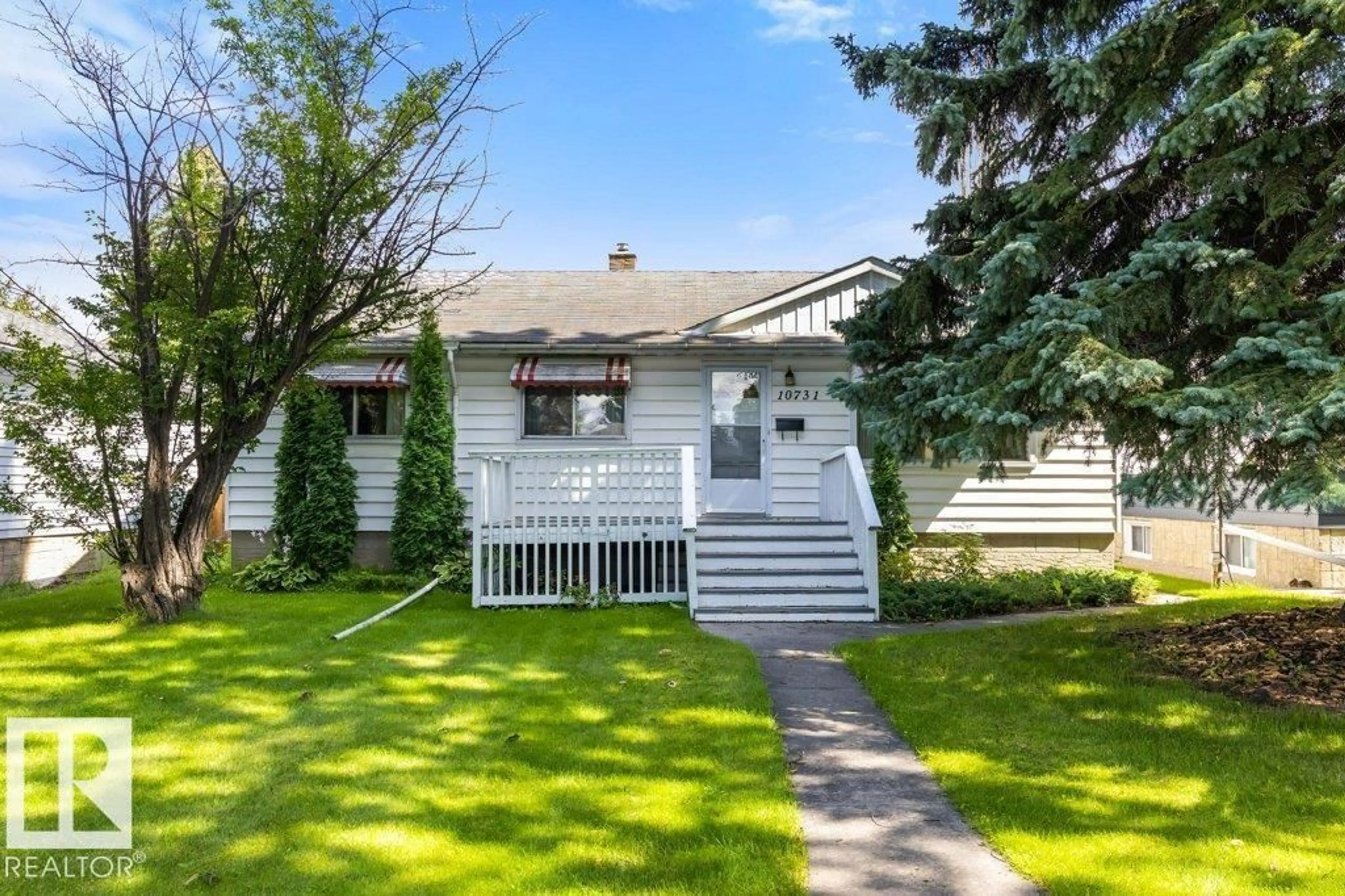 Home with vinyl exterior material, street for 10731 148 ST, Edmonton Alberta T5N3H3
