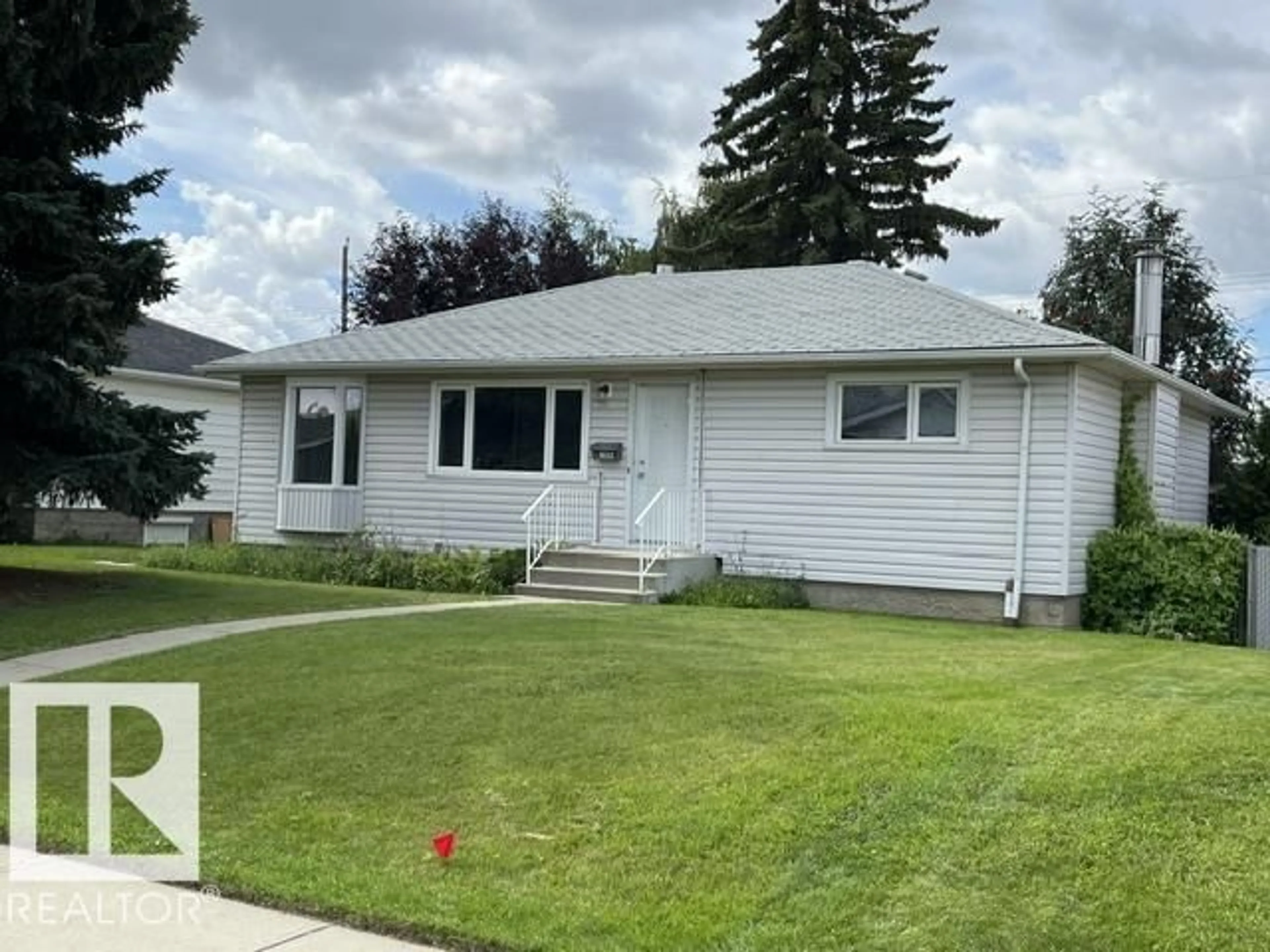 Home with vinyl exterior material, street for NW - 10332 47 ST, Edmonton Alberta T6A1Z7