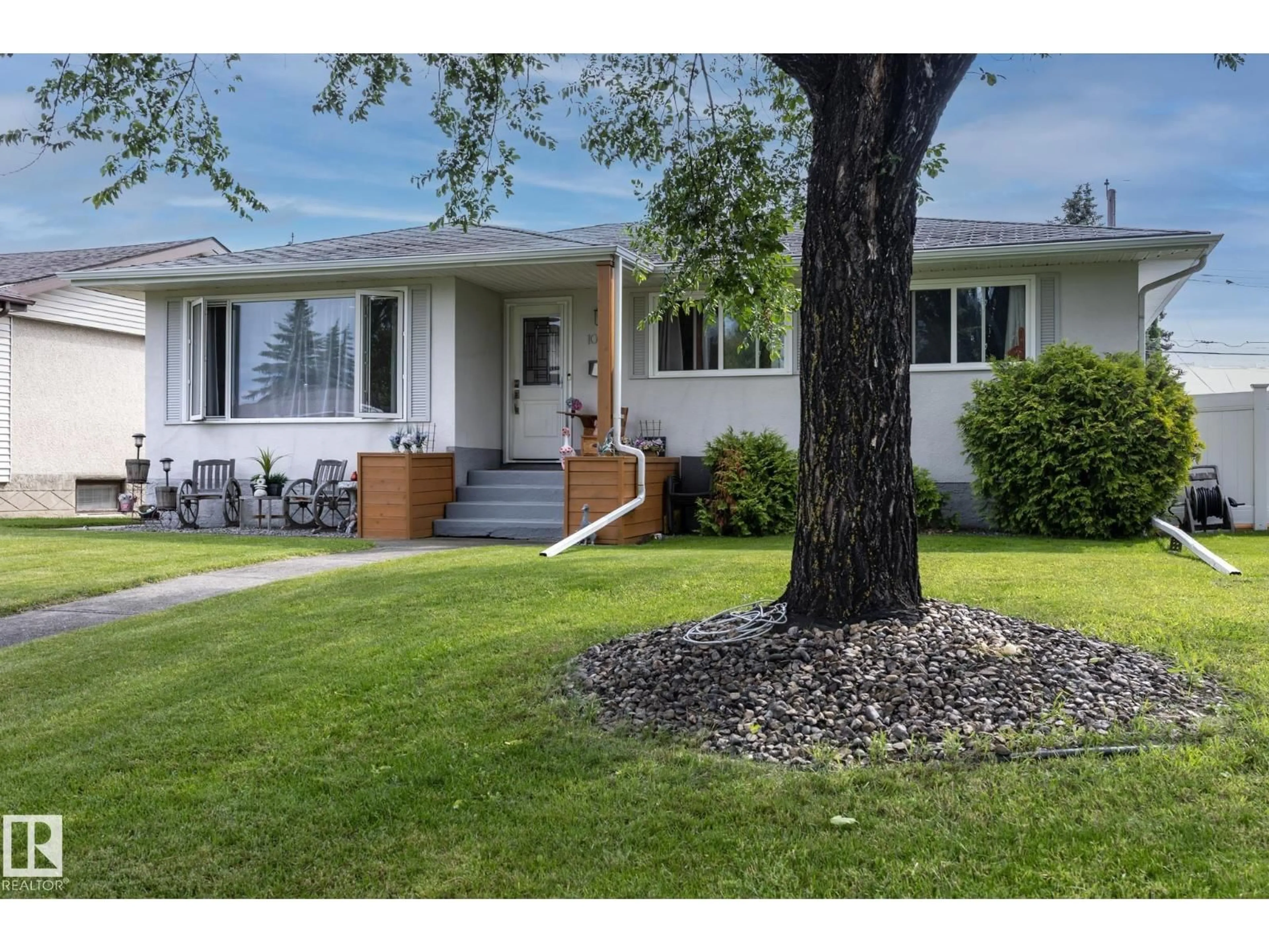 Home with vinyl exterior material, street for NW - 10623 75 ST, Edmonton Alberta T6A2Z8