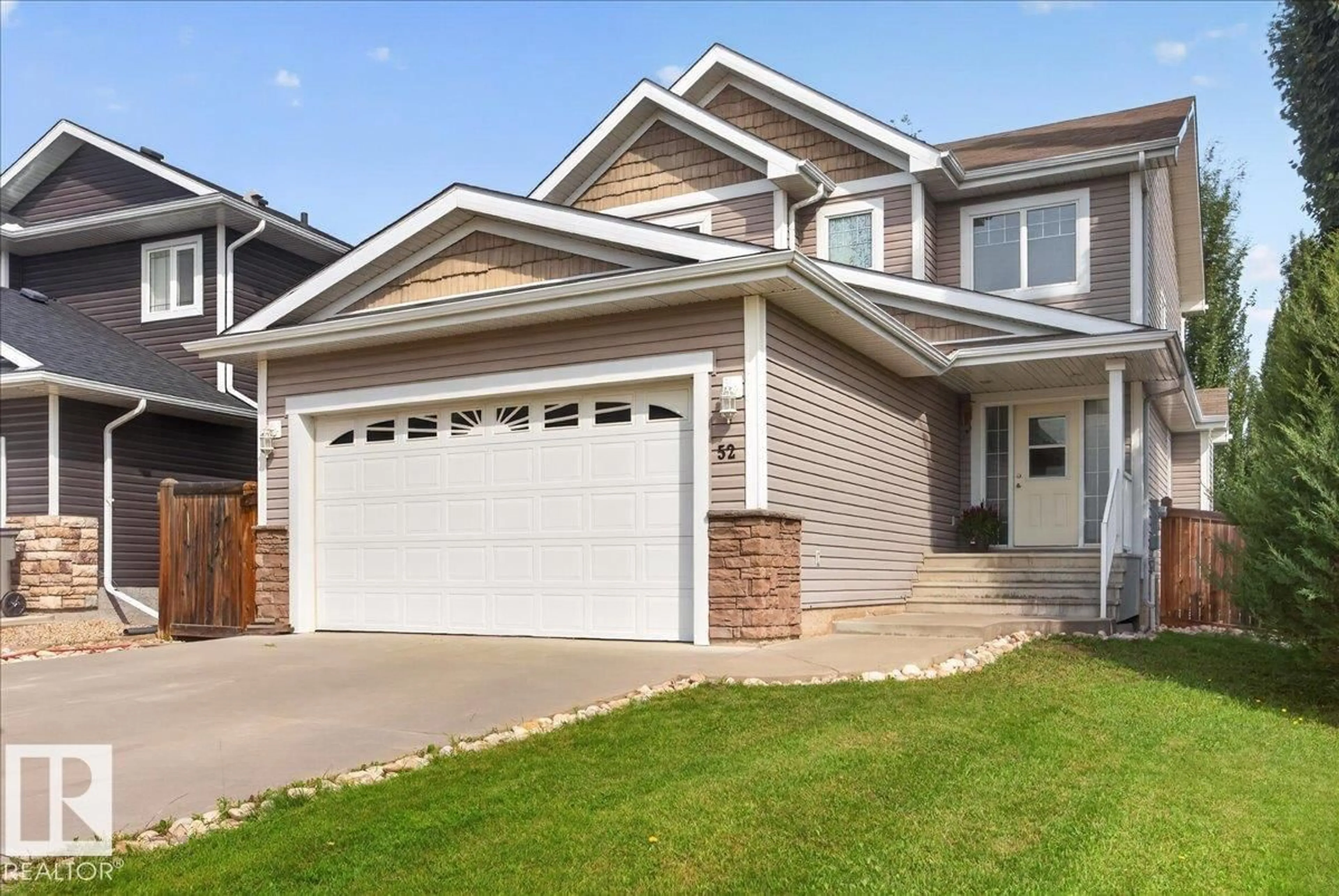 Home with vinyl exterior material, street for 52 LANDING TRAIL DR, Gibbons Alberta T0A1N0