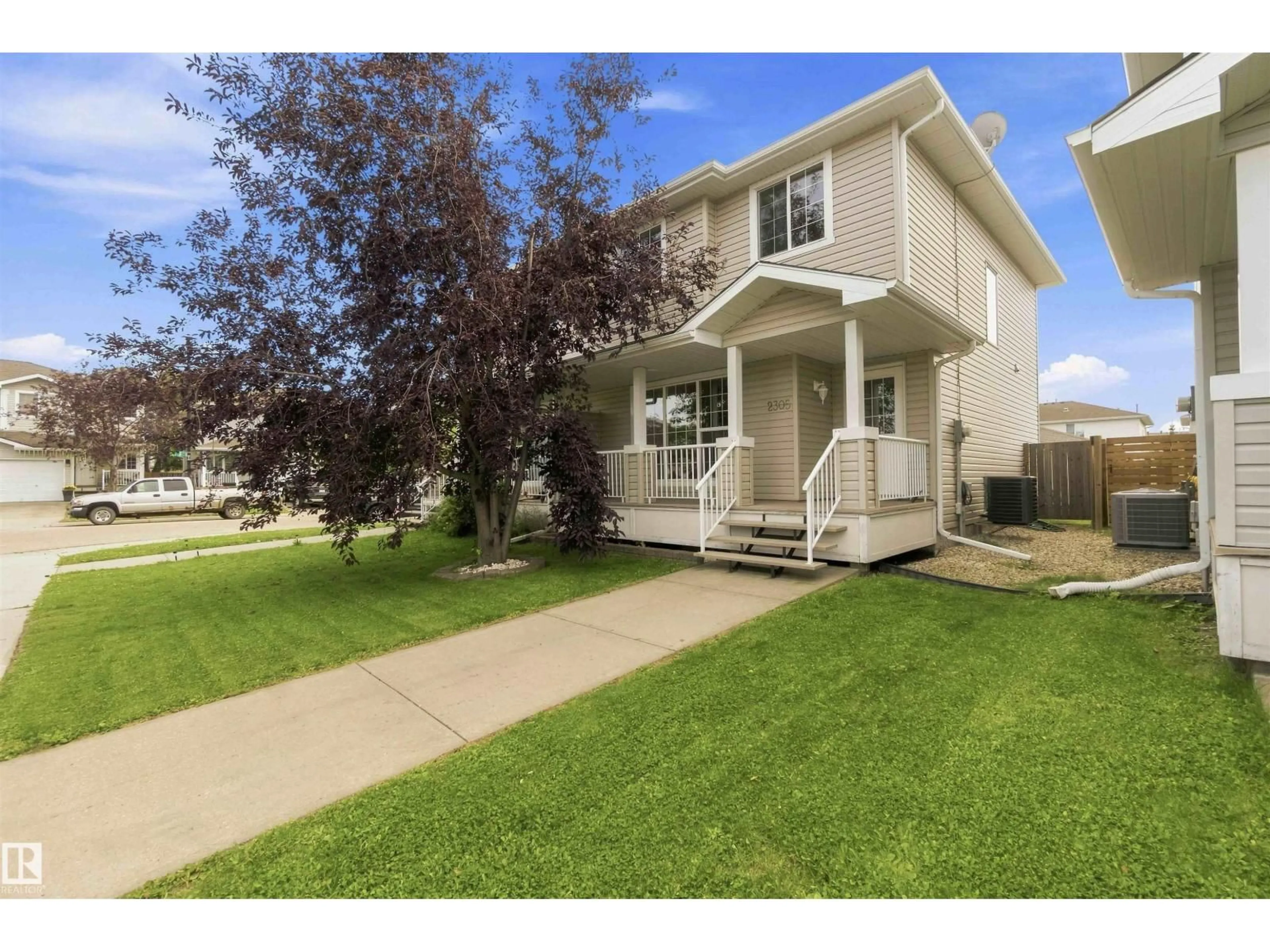 Home with vinyl exterior material, street for 2305 28 AV, Edmonton Alberta T6T0A5