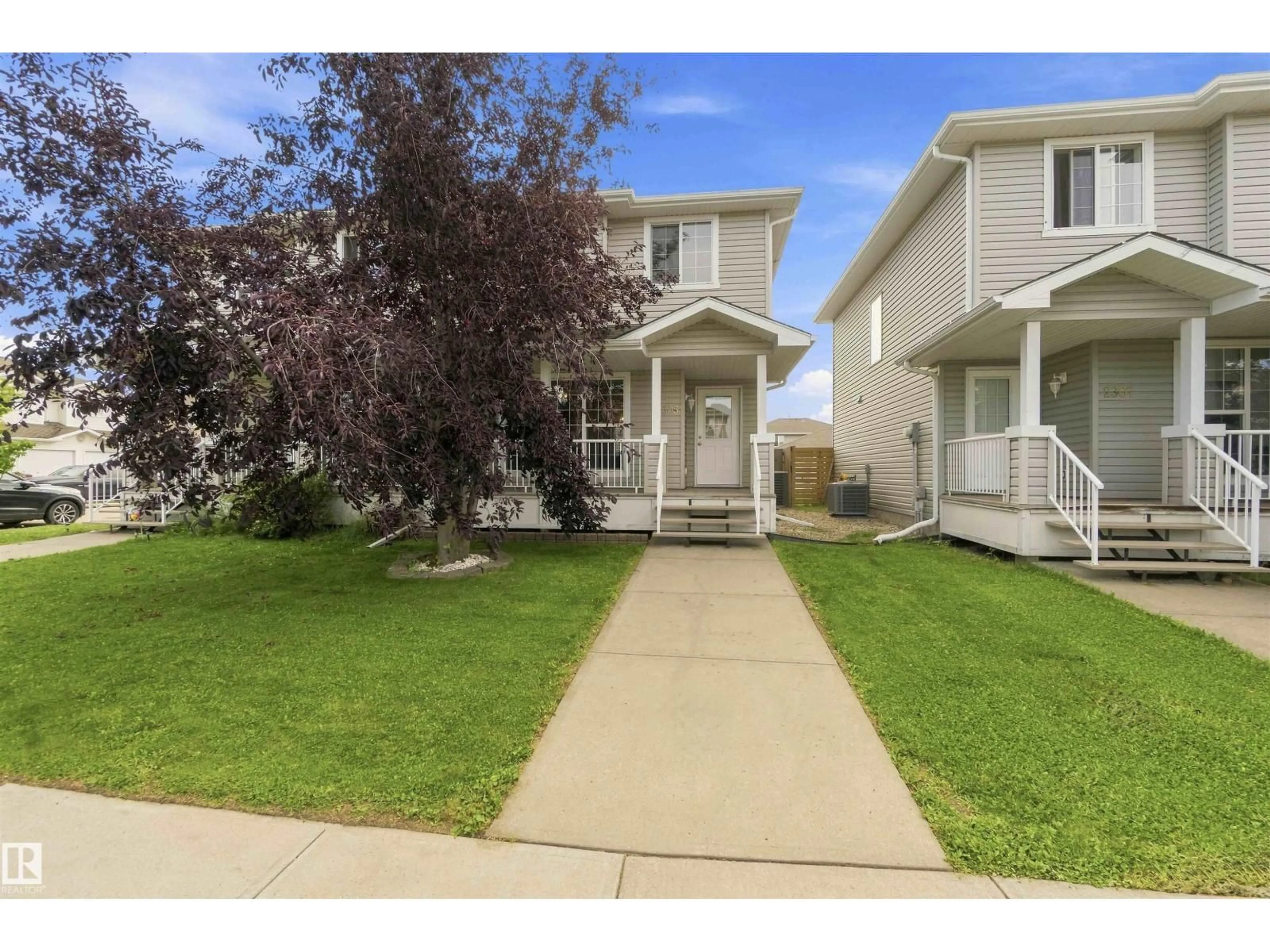 Home with vinyl exterior material, street for 2305 28 AV, Edmonton Alberta T6T0A5