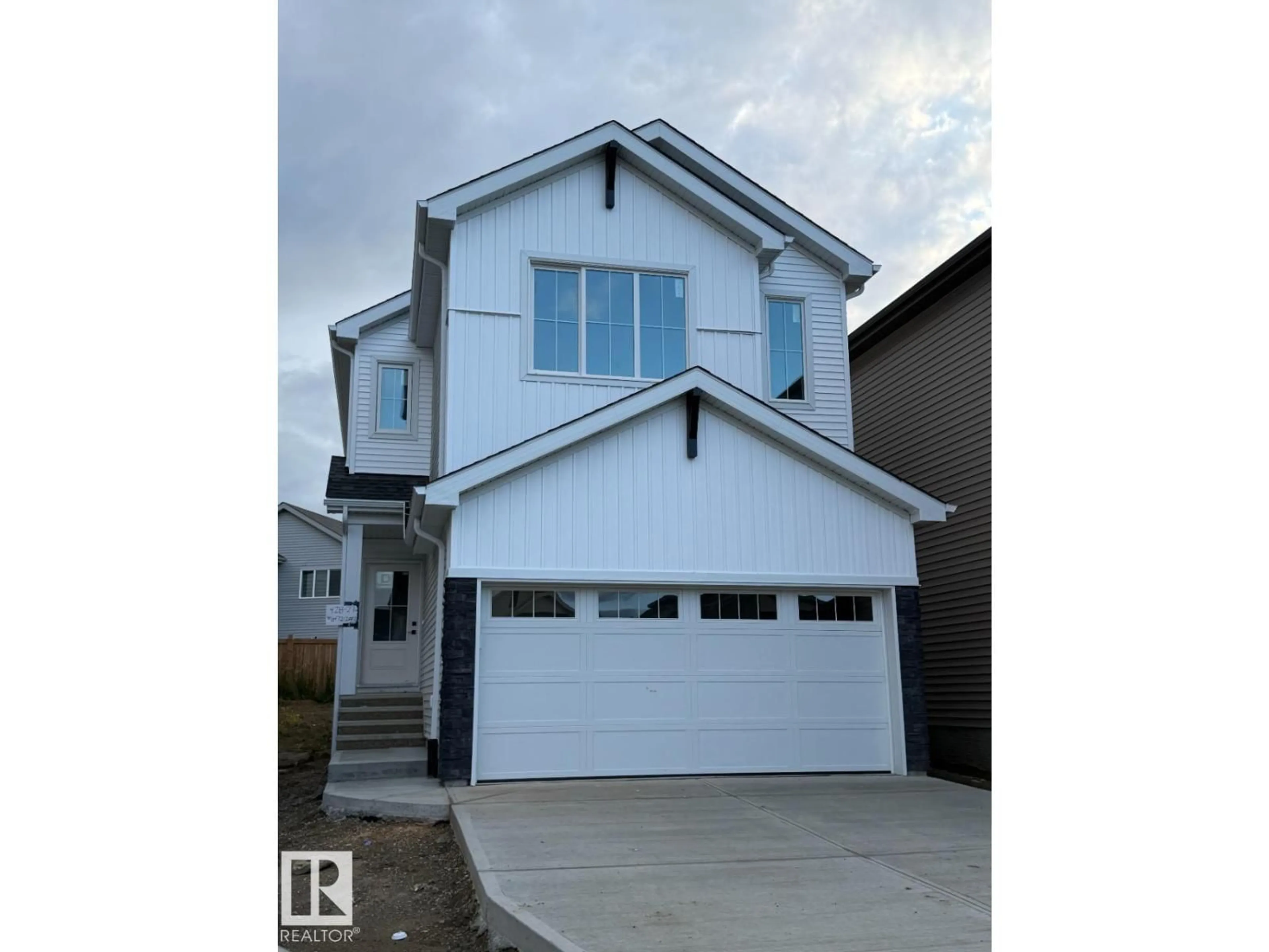 Home with vinyl exterior material, street for SW - 428 27 ST, Edmonton Alberta T6X3H9