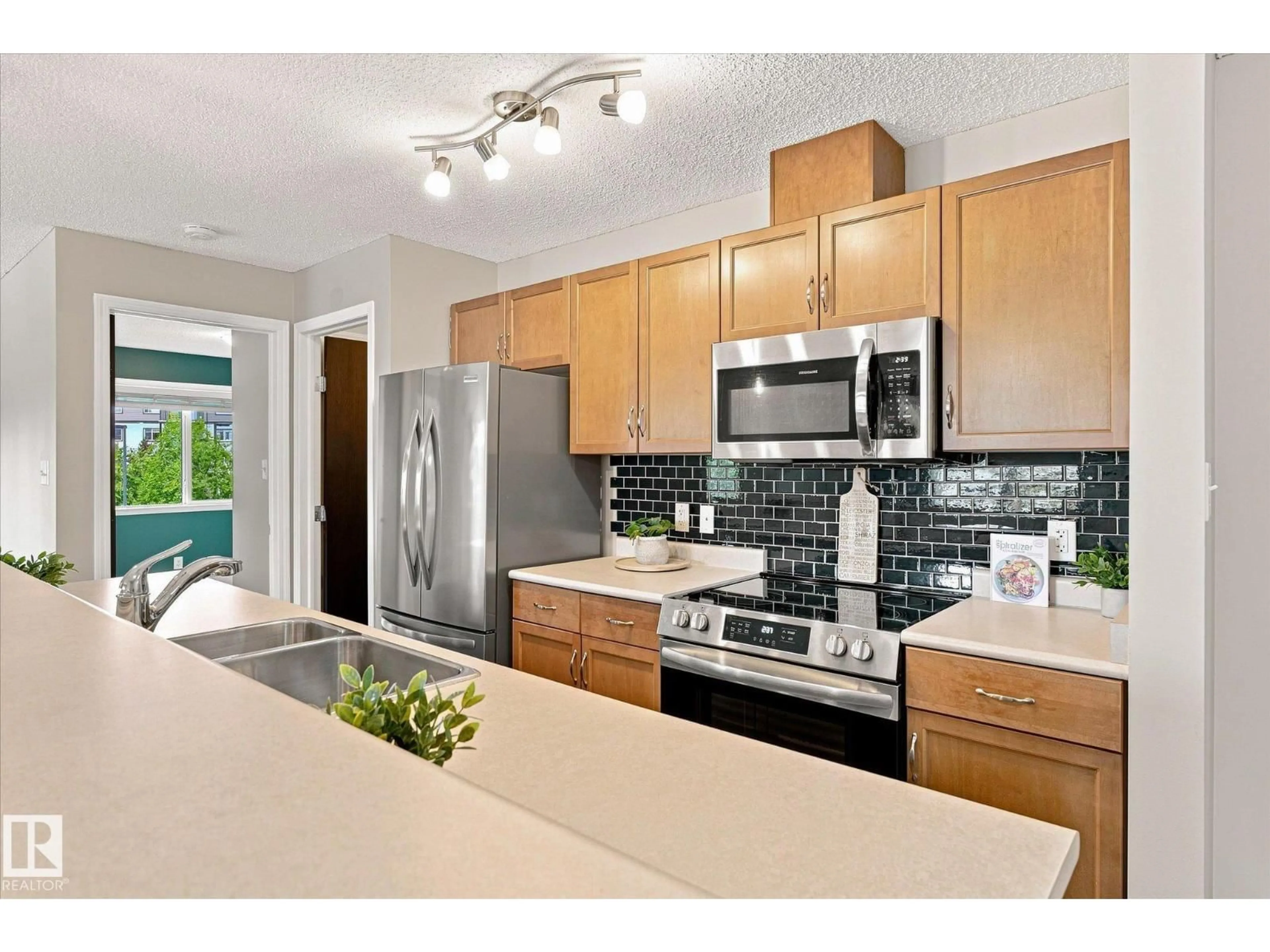 Open concept kitchen, ceramic/tile floor for 1180 - 240 HYNDMAN RD, Edmonton Alberta T5A0P8