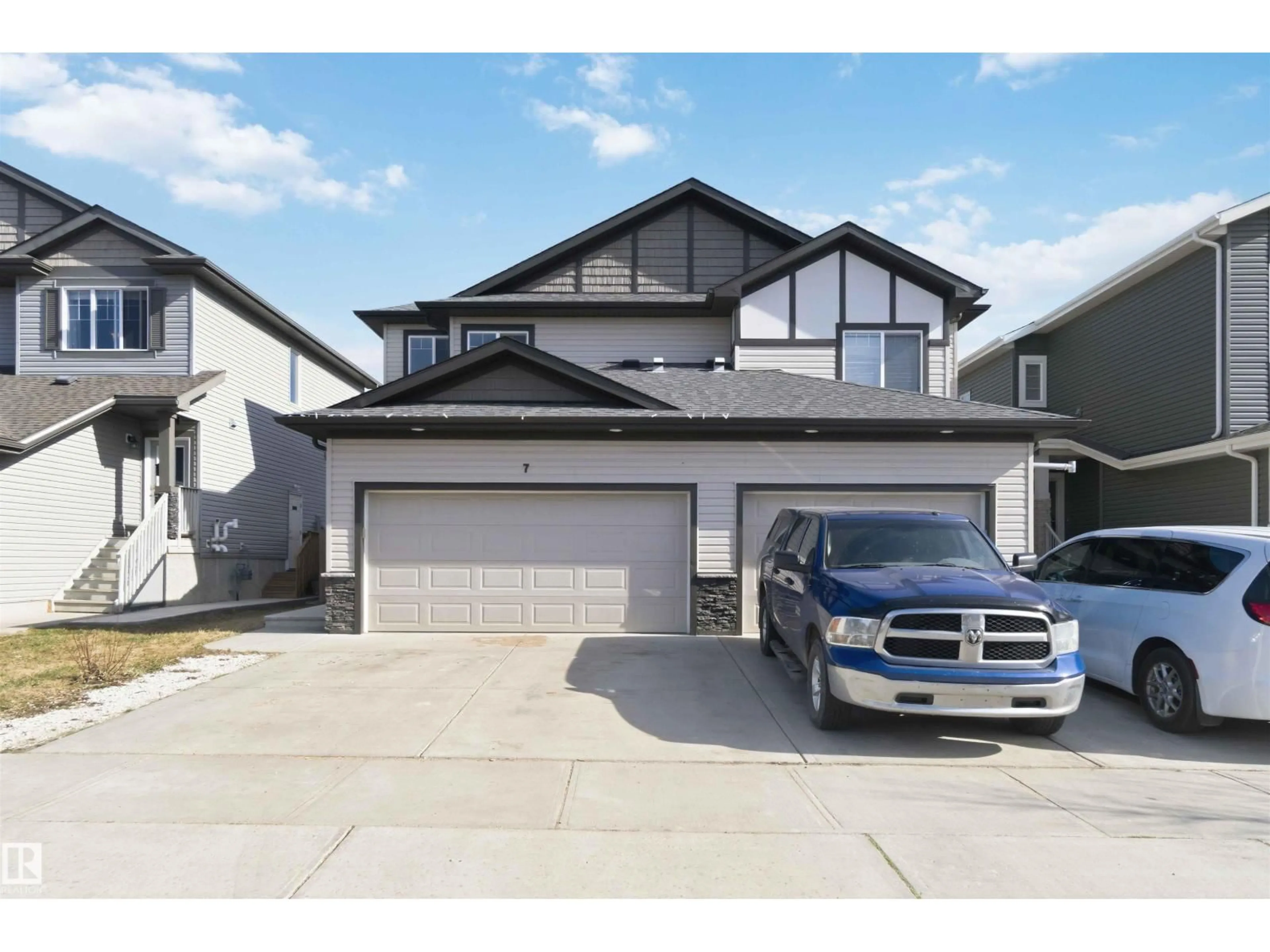 Home with vinyl exterior material, street for 7 MCLEAN, Leduc Alberta T9E0P1