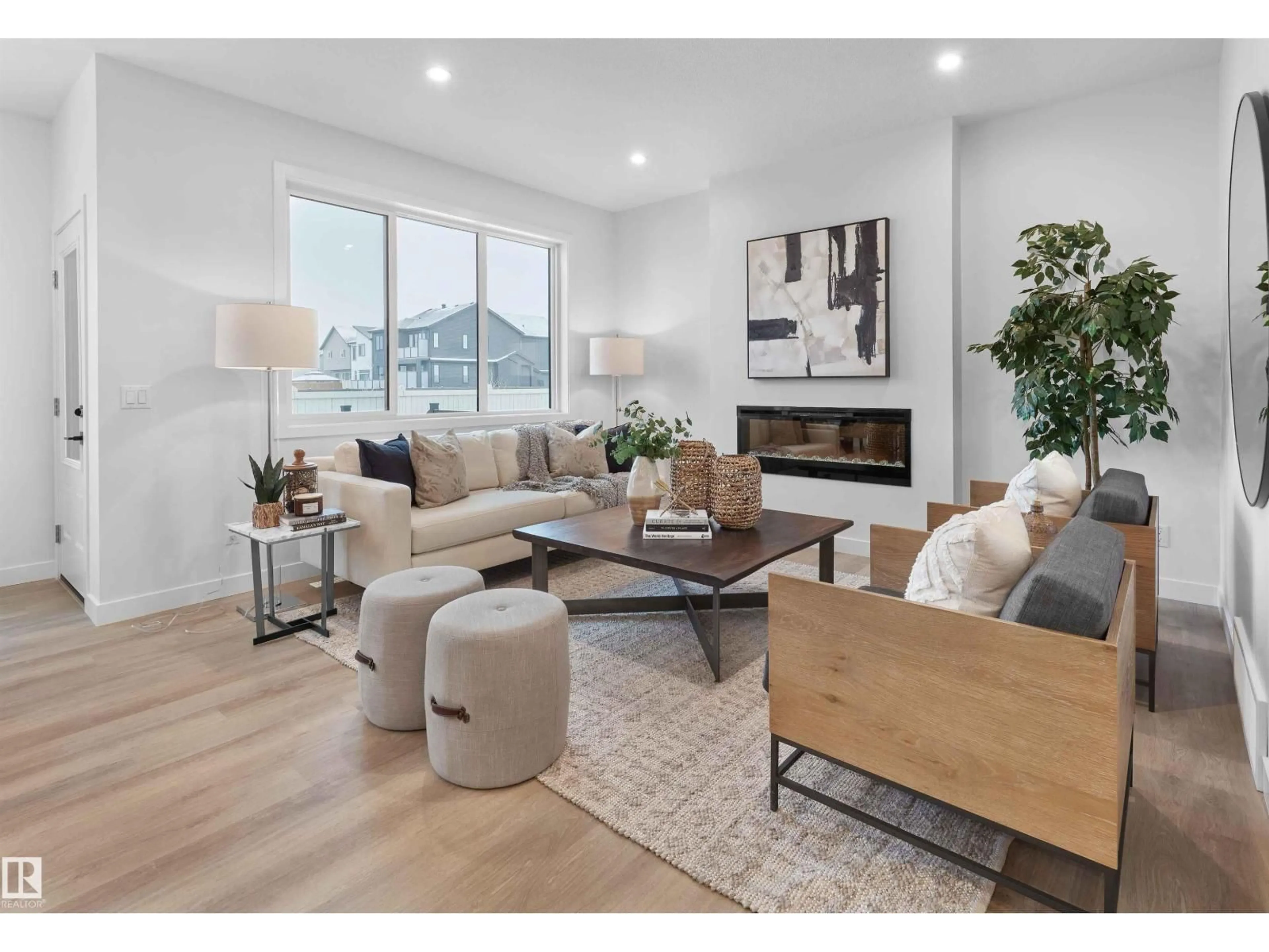 Living room with furniture, wood/laminate floor for SW - 12532 34 AV, Edmonton Alberta T6W5Z8