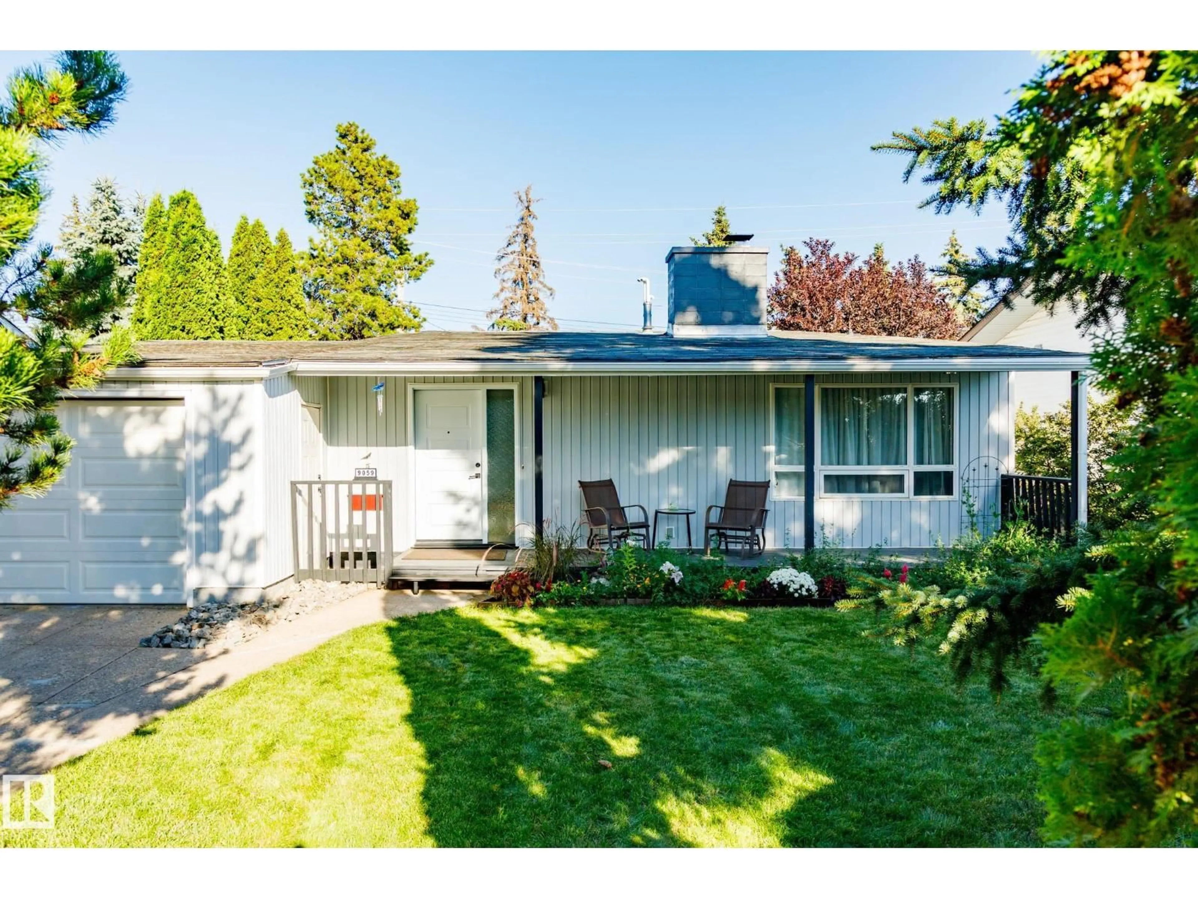 Home with vinyl exterior material, street for 9059 52 ST, Edmonton Alberta T6B1G1