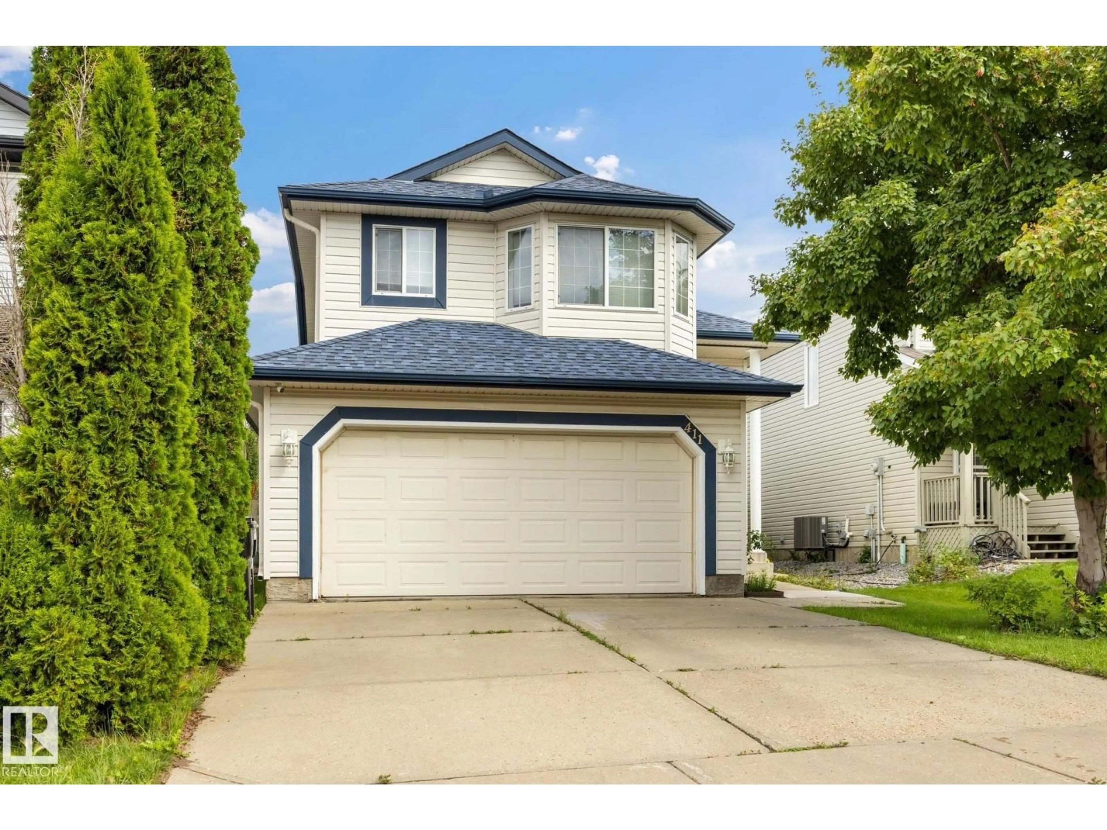 Home with vinyl exterior material, street for 411 86 ST, Edmonton Alberta T6X1G3