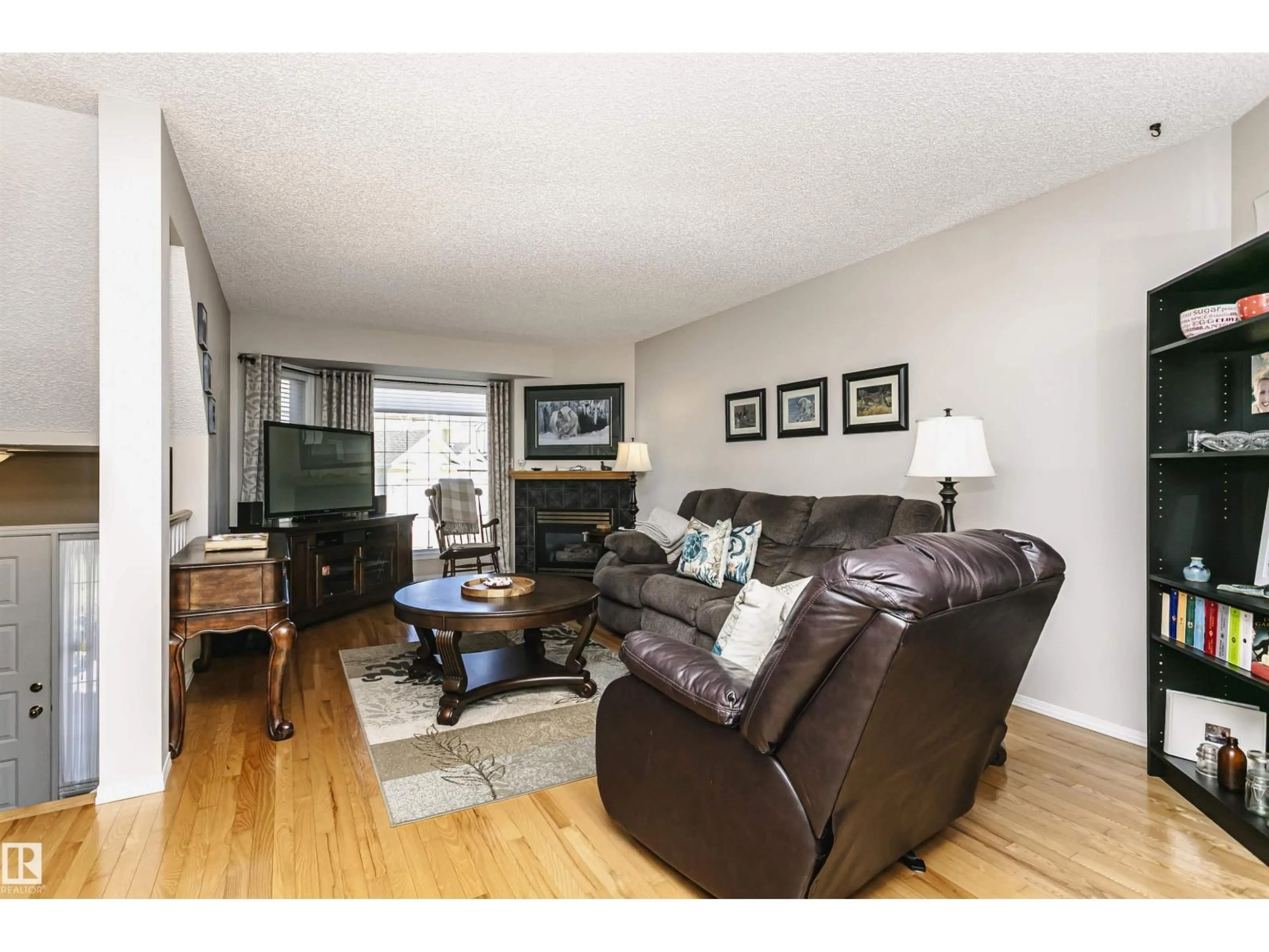 Living room with furniture, wood/laminate floor for #22 - 11717 9B AV, Edmonton Alberta T6J7B7
