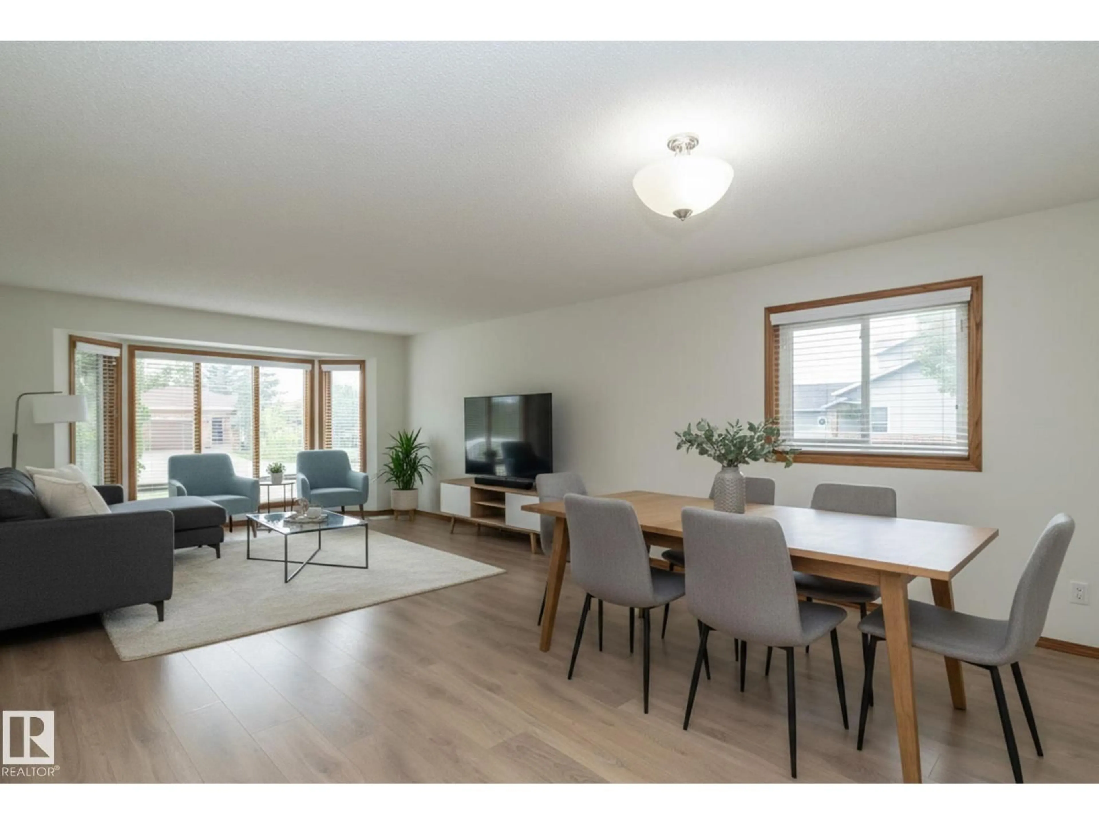 Living room with furniture, wood/laminate floor for 11138 30 AV, Edmonton Alberta T6J3Y6