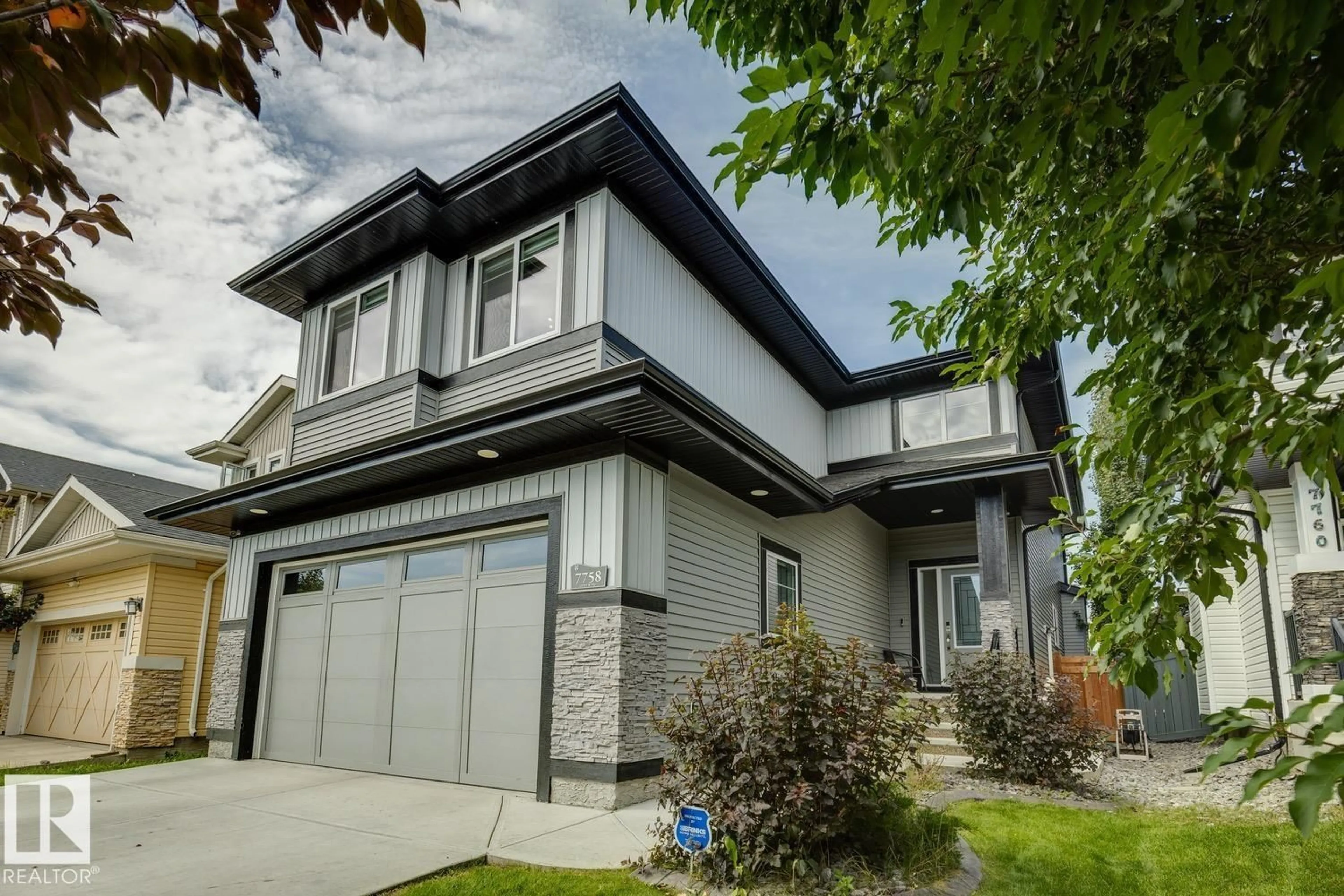 Home with vinyl exterior material, street for NW - 7758 GETTY WD, Edmonton Alberta T5T4T3
