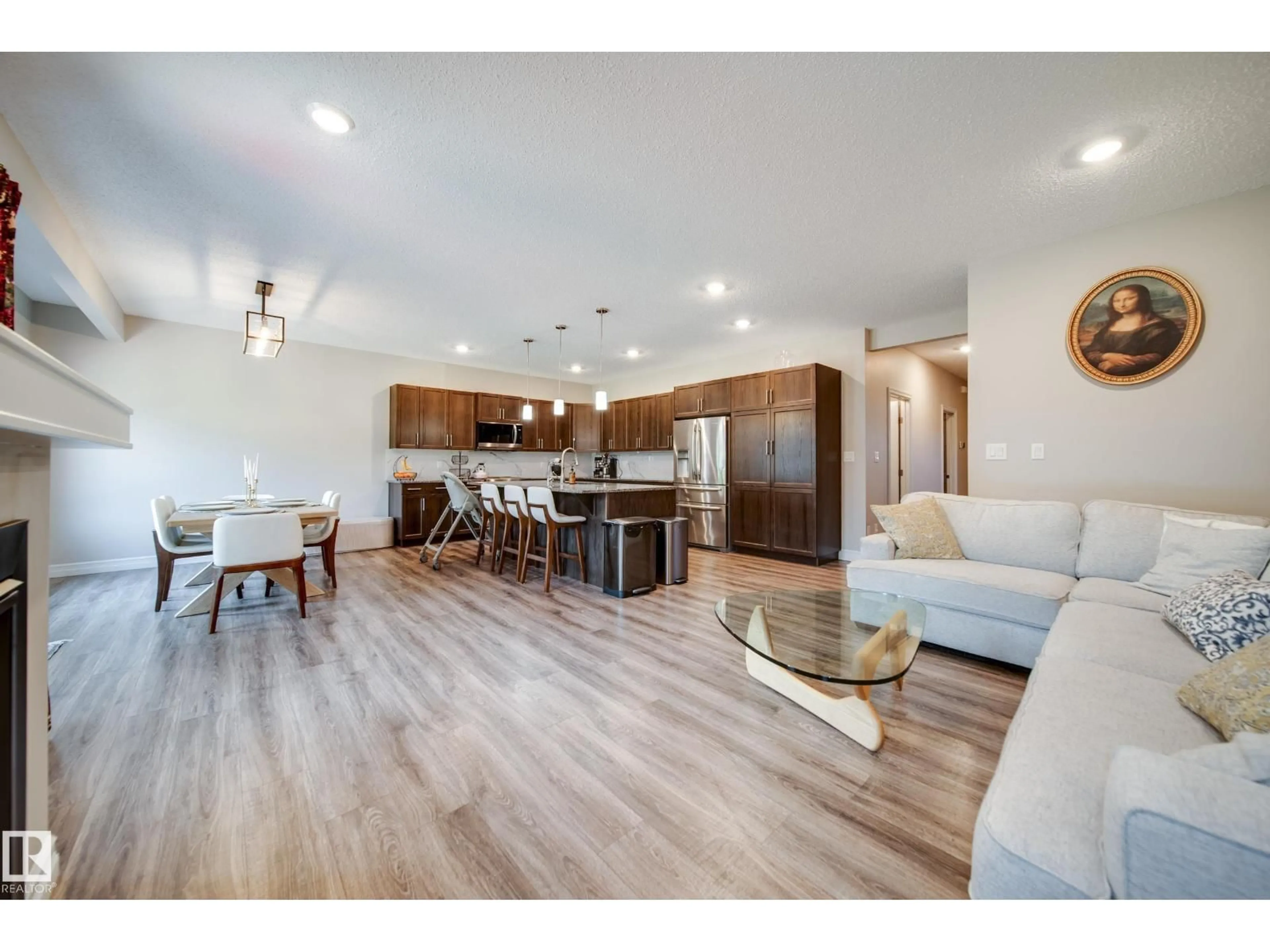 Open concept kitchen, wood/laminate floor for 3632 KESWICK BV, Edmonton Alberta T6W3S5