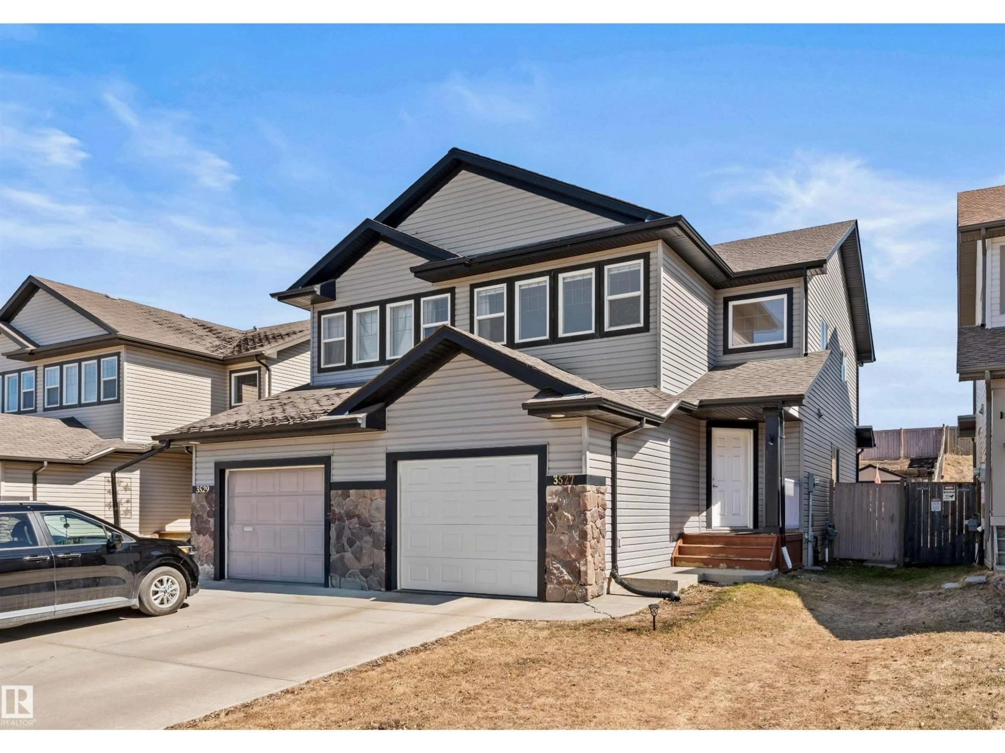 Home with vinyl exterior material, street for 3527 11 ST, Edmonton Alberta T6T0E9