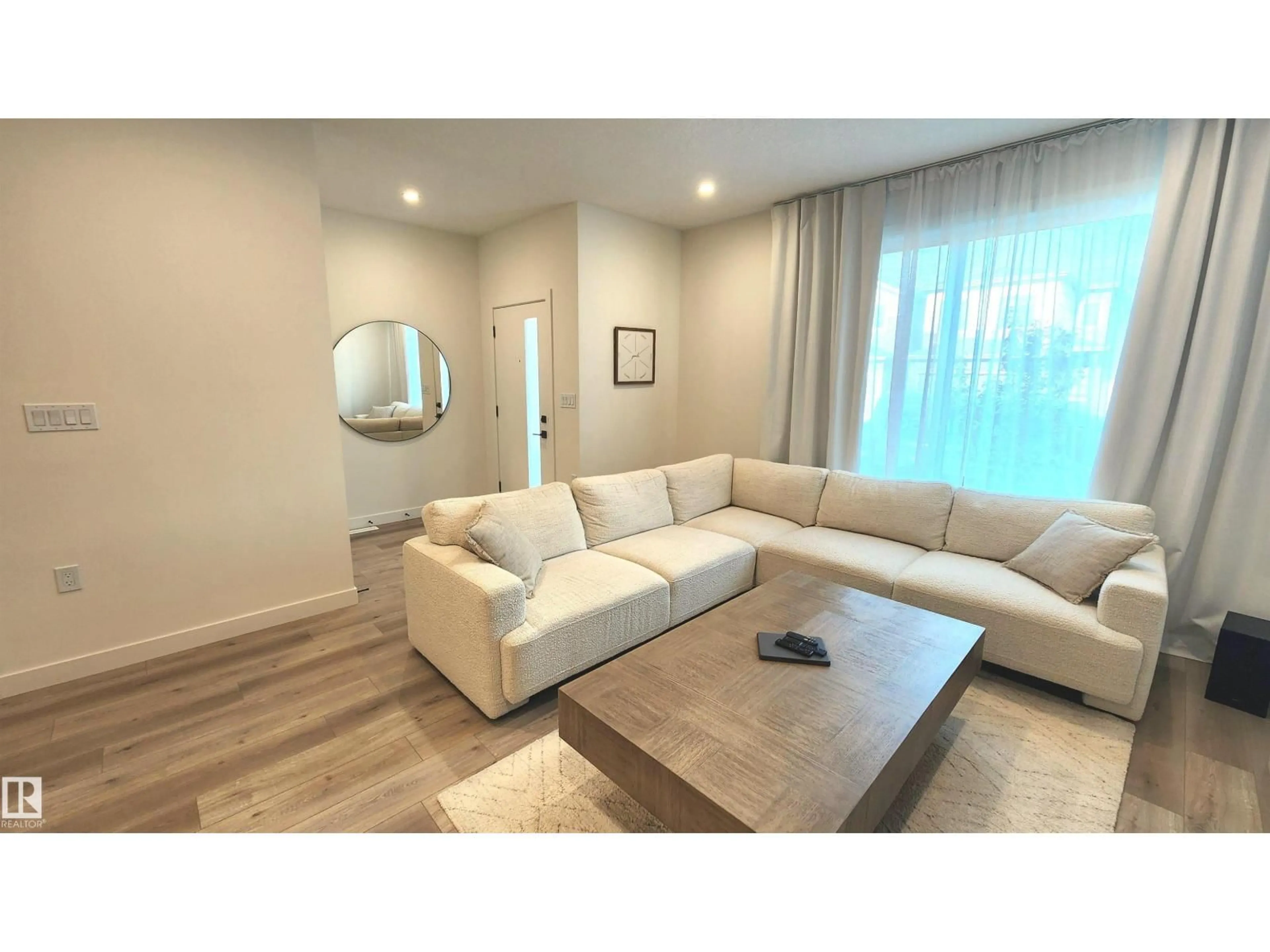 Living room with furniture, wood/laminate floor for 220 28 ST, Edmonton Alberta T6X3E4