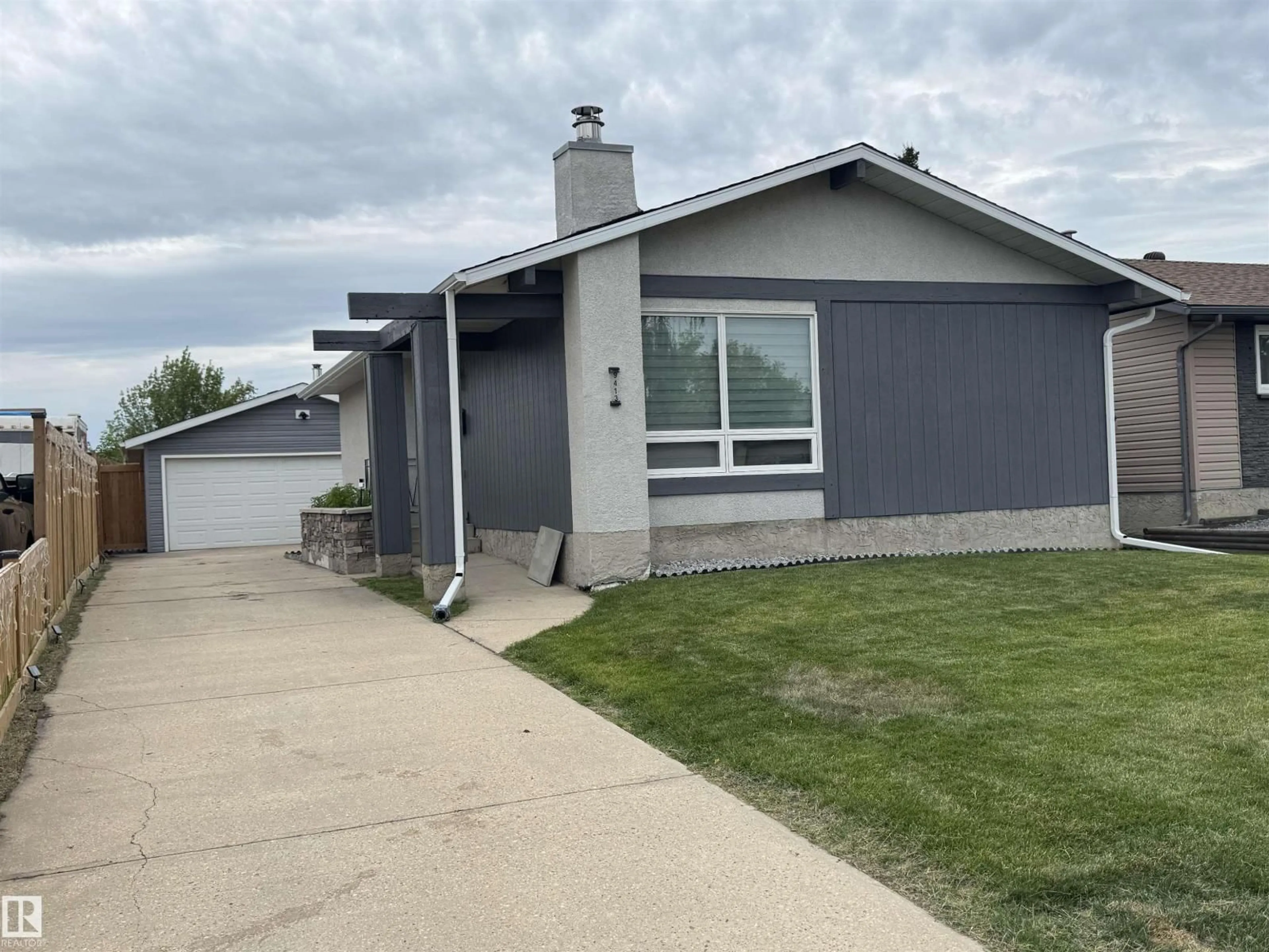 Home with vinyl exterior material, street for 9413 80 ST, Fort Saskatchewan Alberta T8L3R5