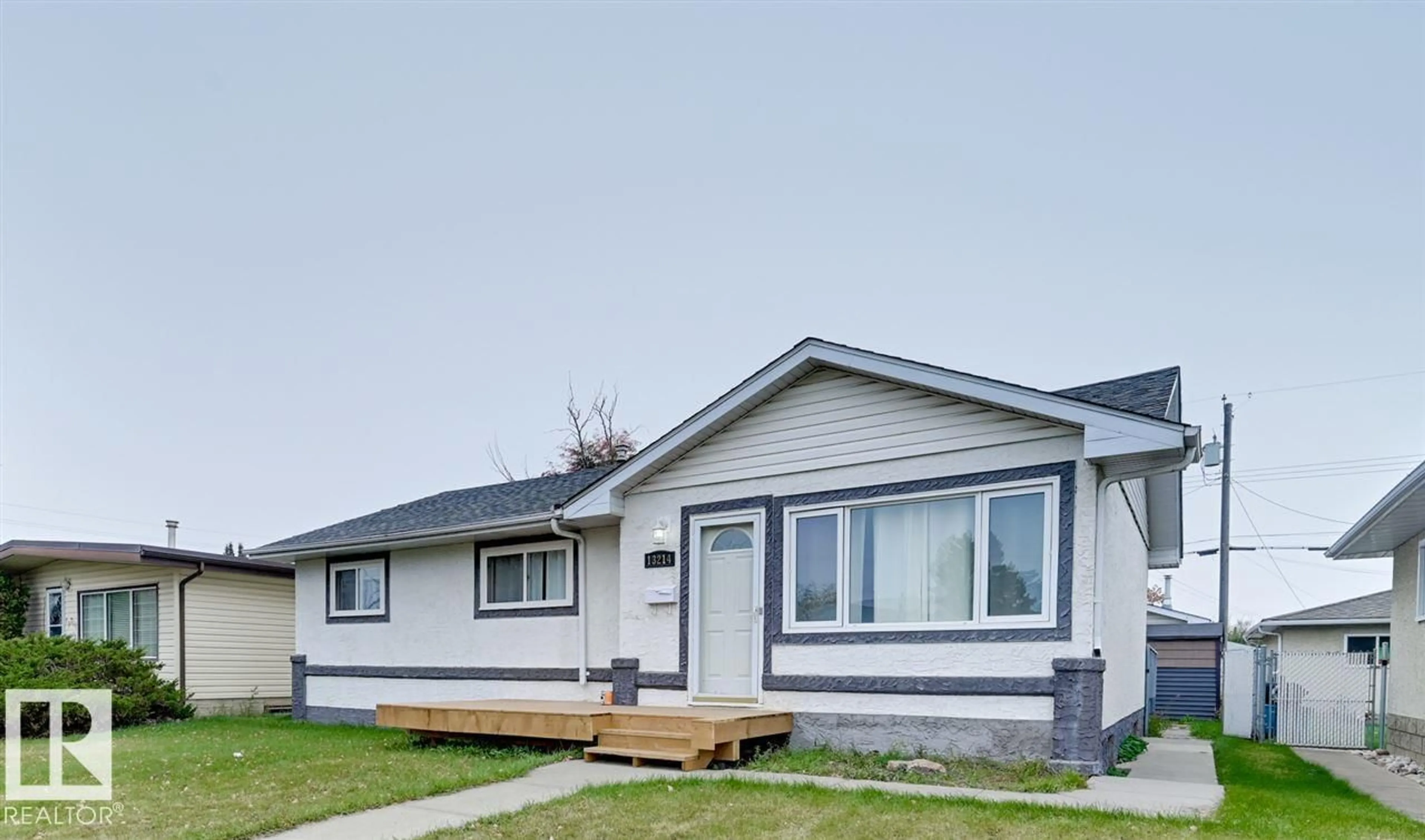 Home with vinyl exterior material, street for 13214 123 ST, Edmonton Alberta T5L0J9