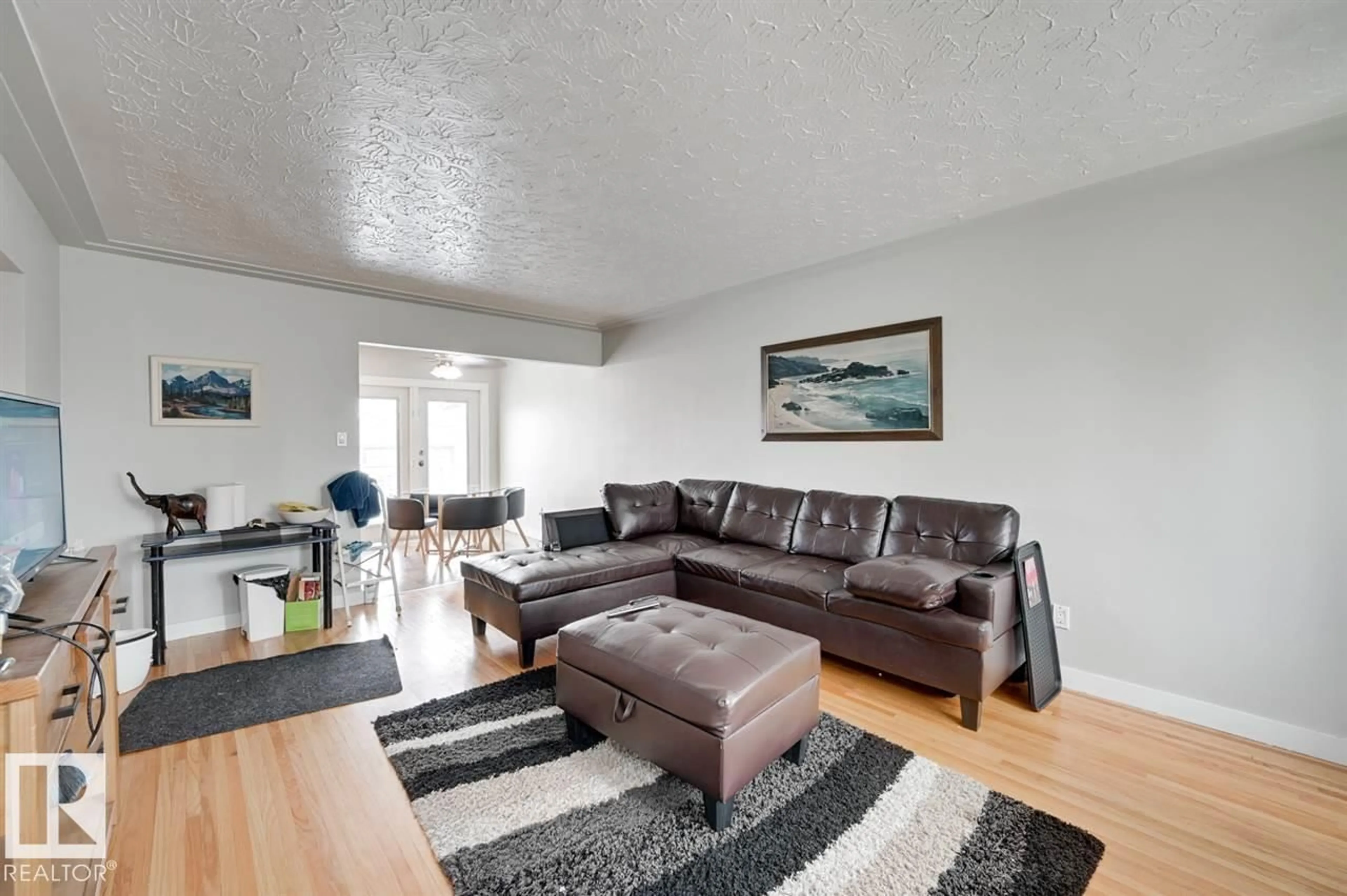 Living room with furniture, wood/laminate floor for 13214 123 ST, Edmonton Alberta T5L0J9
