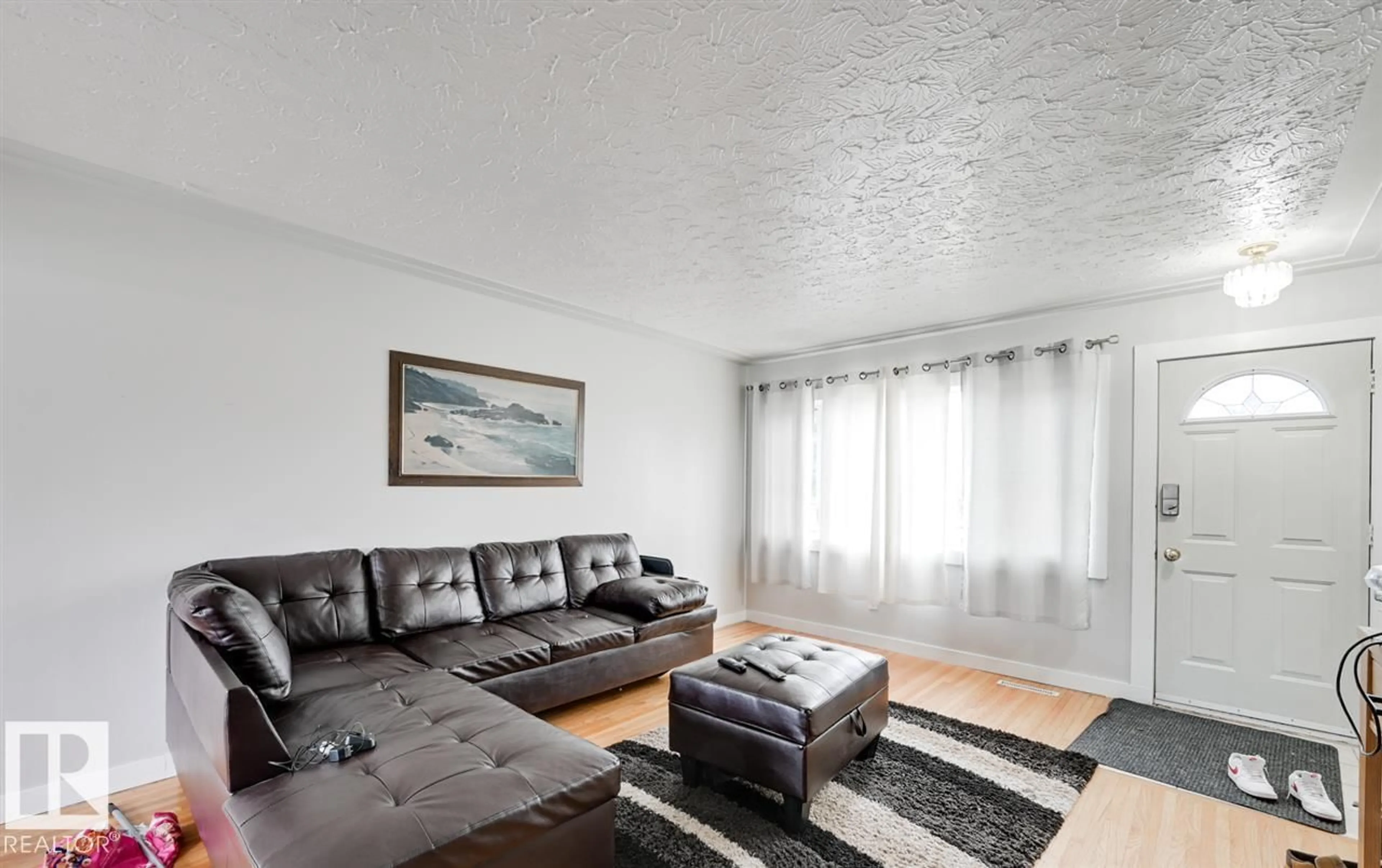 Living room with furniture, wood/laminate floor for 13214 123 ST, Edmonton Alberta T5L0J9
